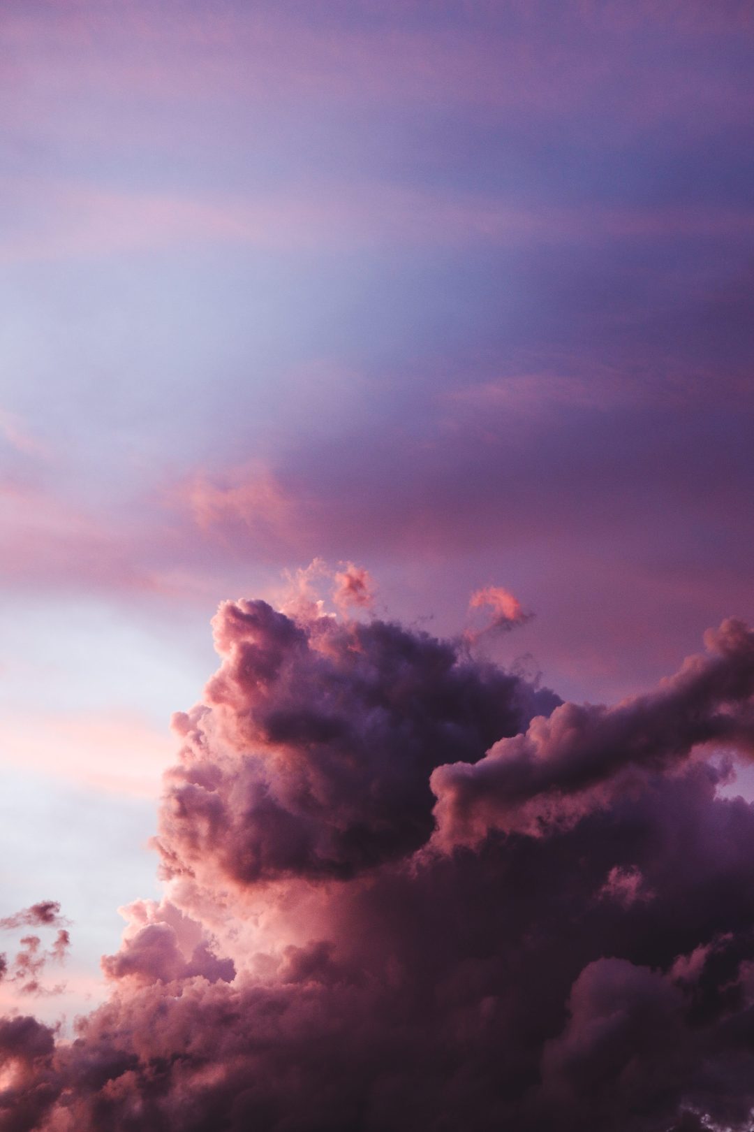 A photo of a purple and pink sky with clouds - Magic
