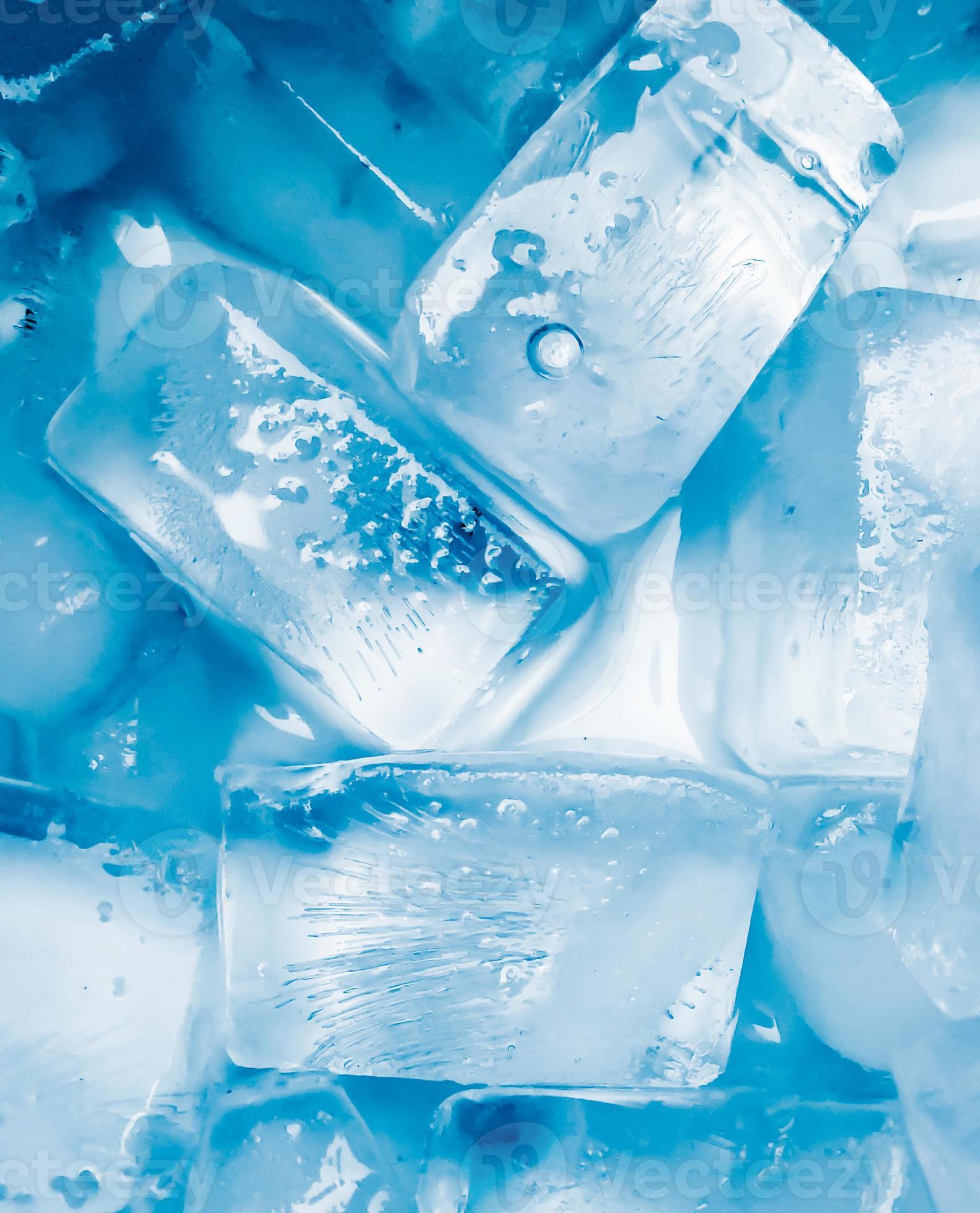 A close up of ice cubes in water - Ice