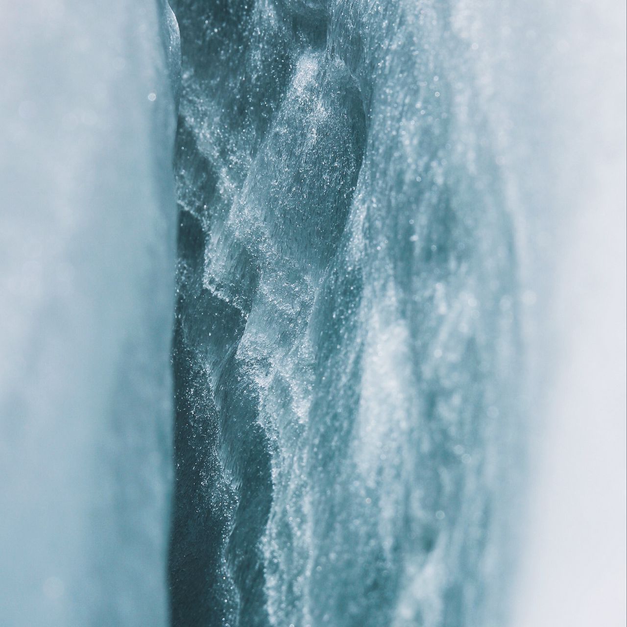 A person is standing on top of an iceberg - Ice