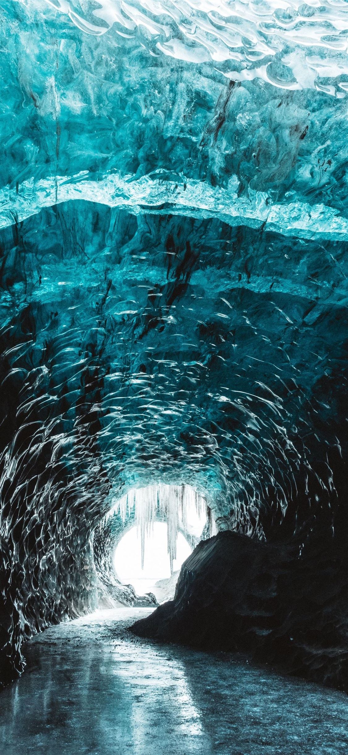 A tunnel that is inside of an ice cave - Ice