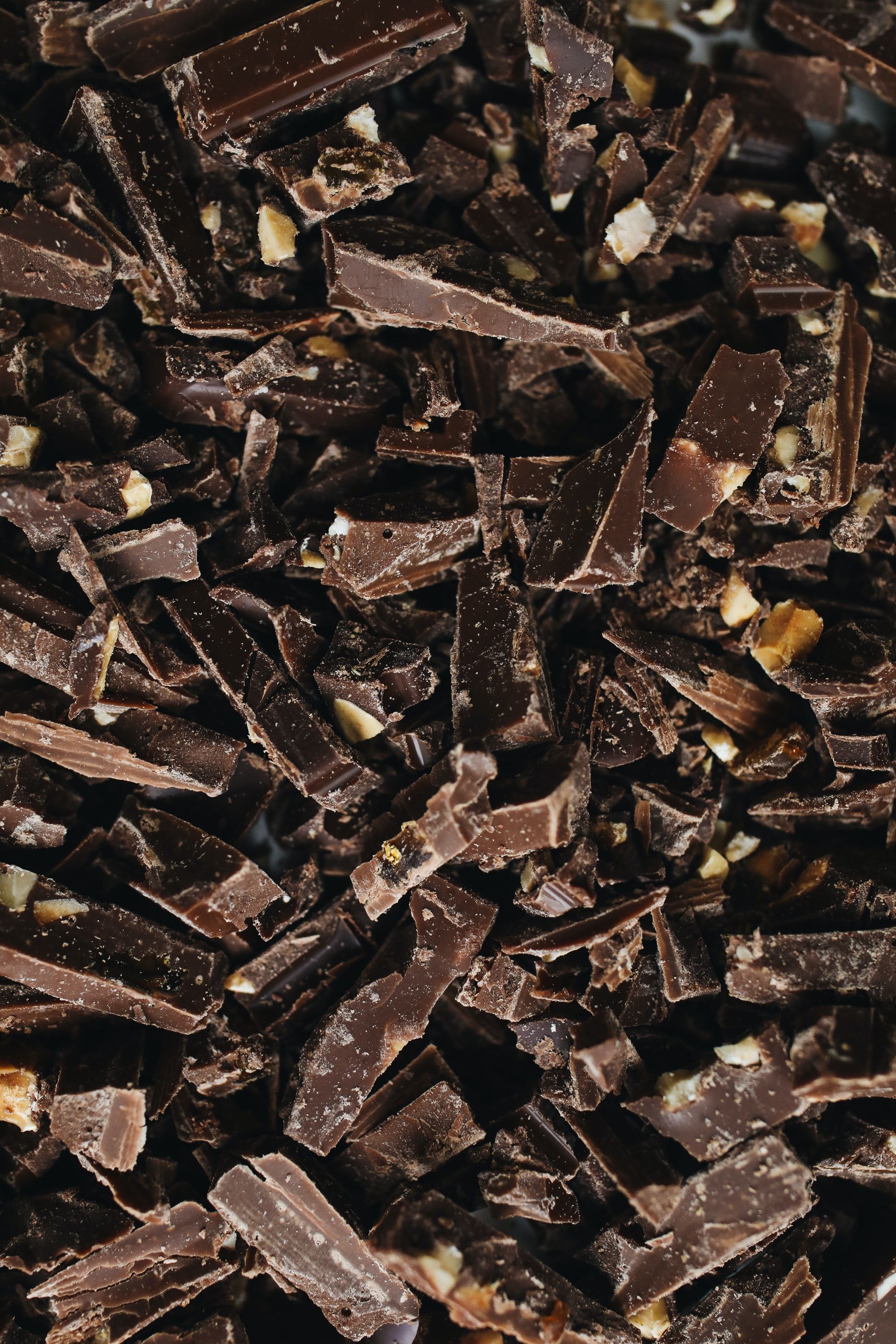 A close up of chopped chocolate and nuts - Chocolate