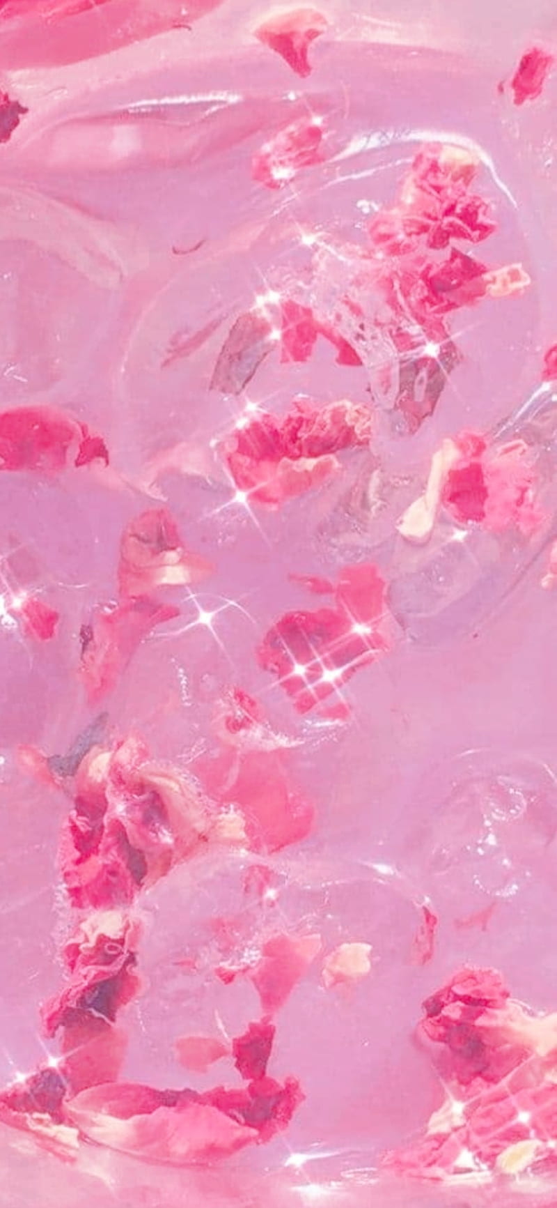 A close up of a pink marble background with flowers - Doja Cat