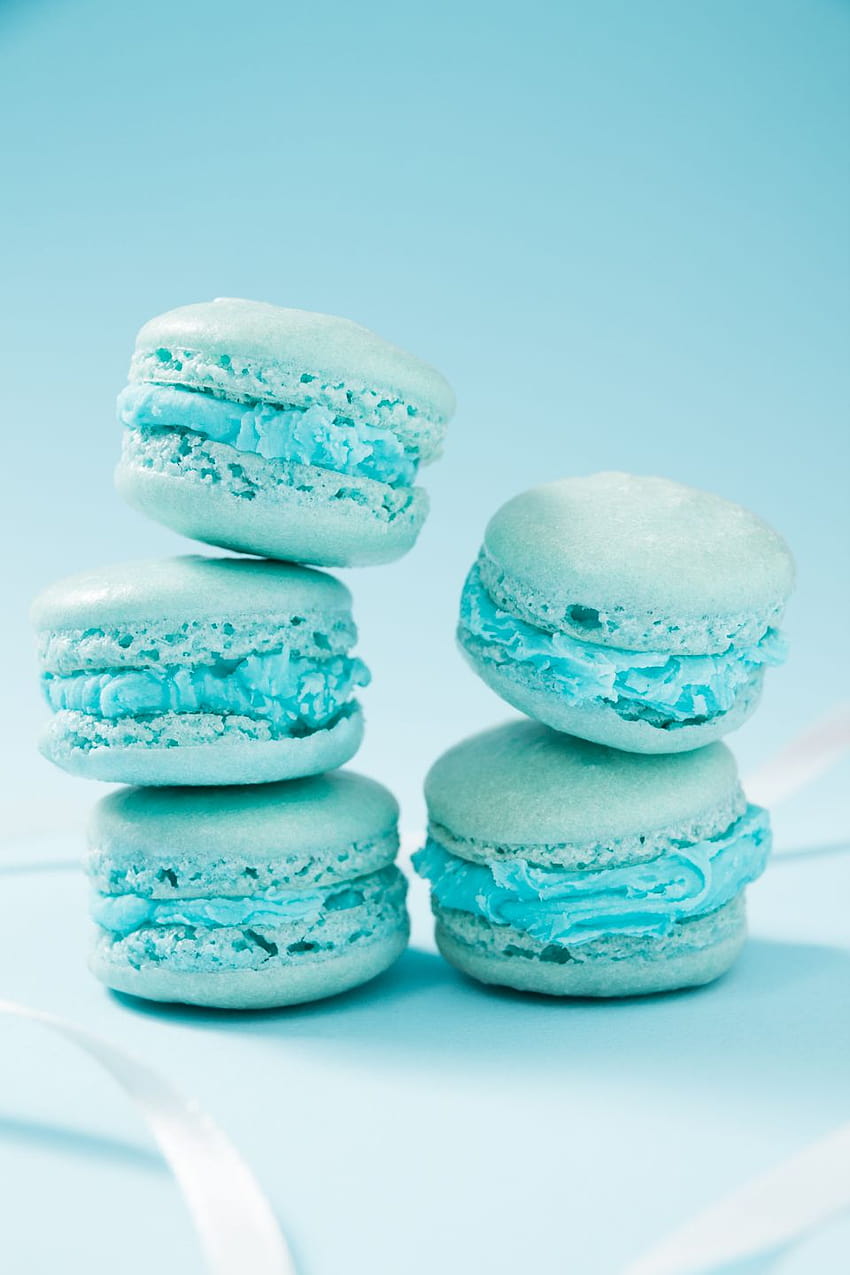 A stack of macarons with blue frosting - Aqua