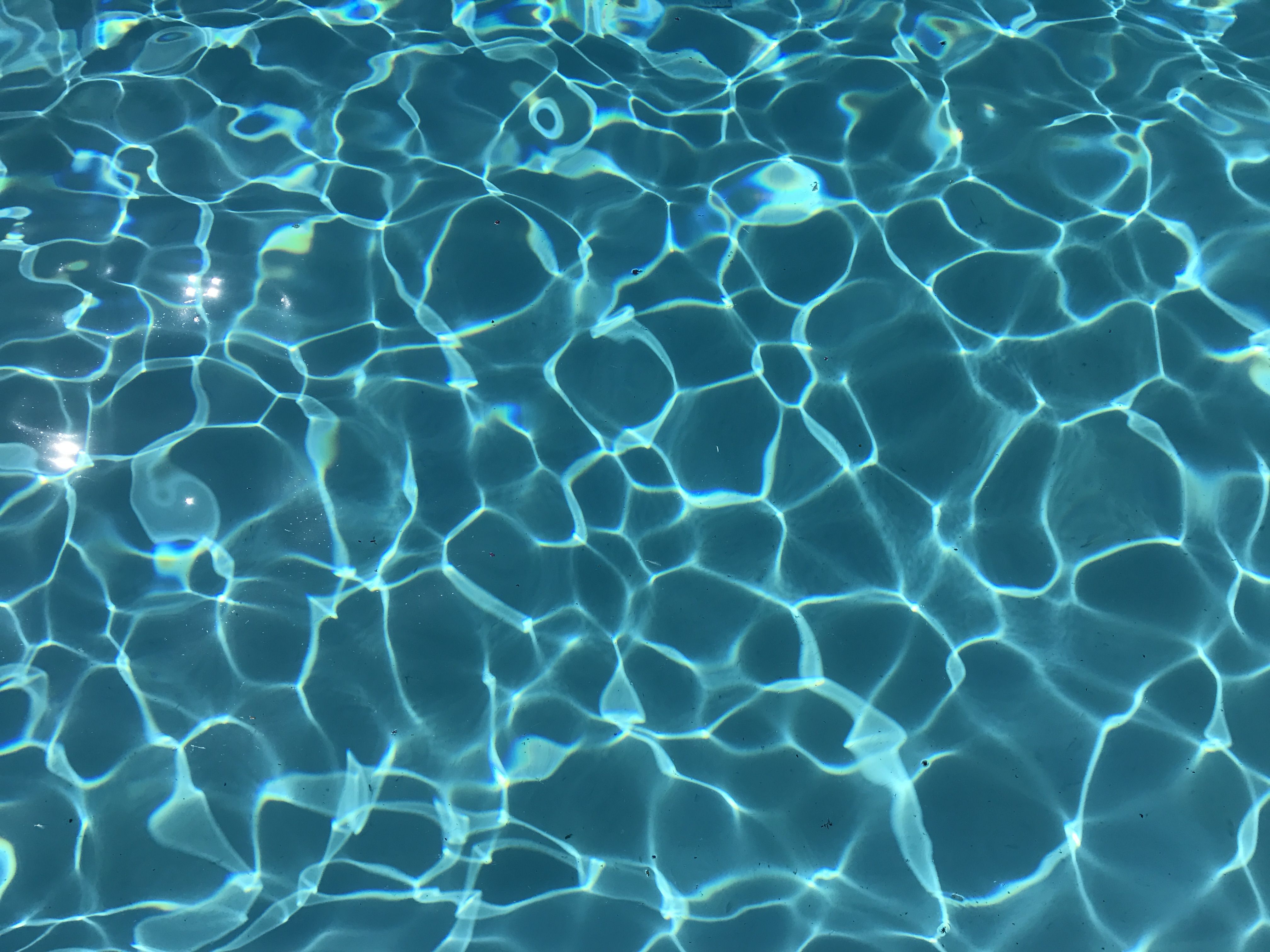 A close up of the water in an outdoor pool - Aqua, water, swimming pool