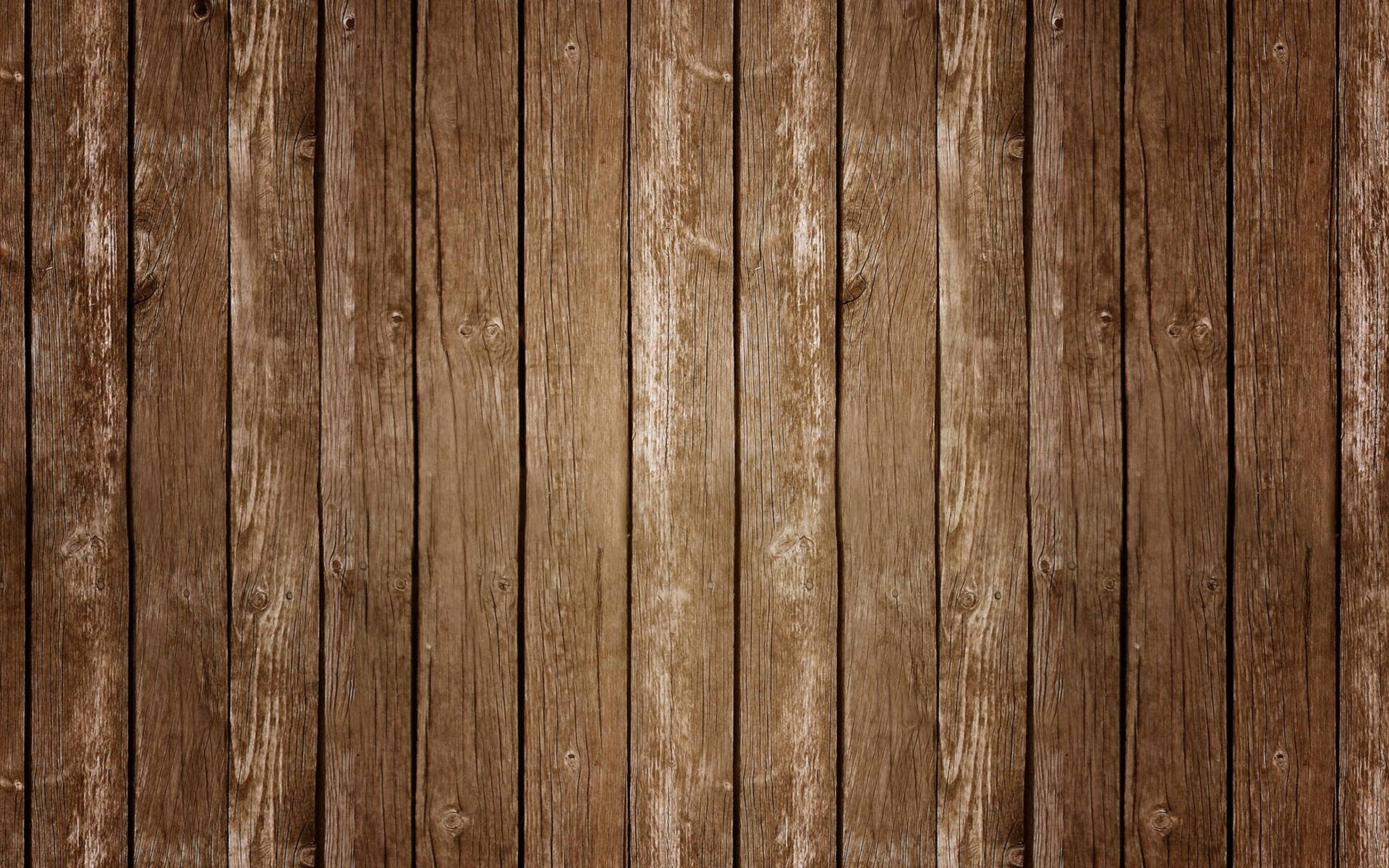 A brown wooden fence with a few nails - Woods