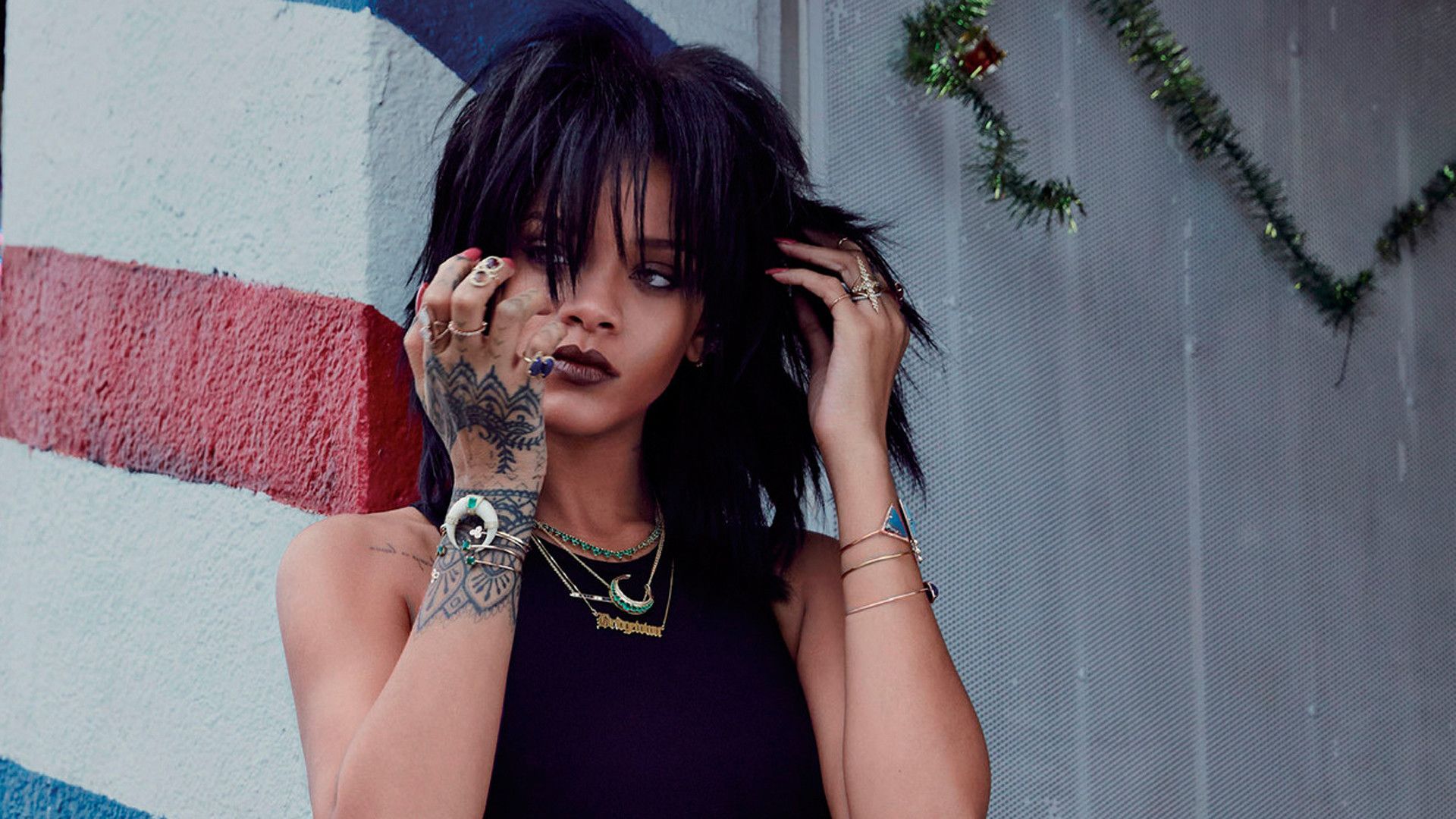 A woman with tattoos on her hand - Rihanna