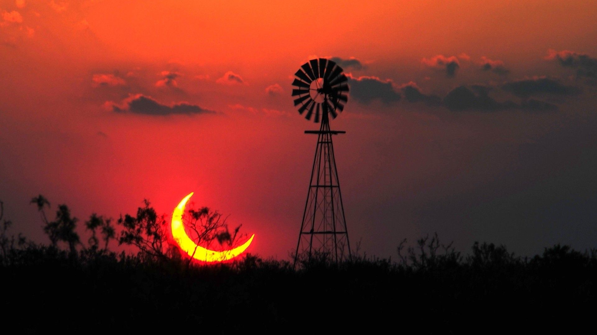 A sunset with the moon in it - Texas