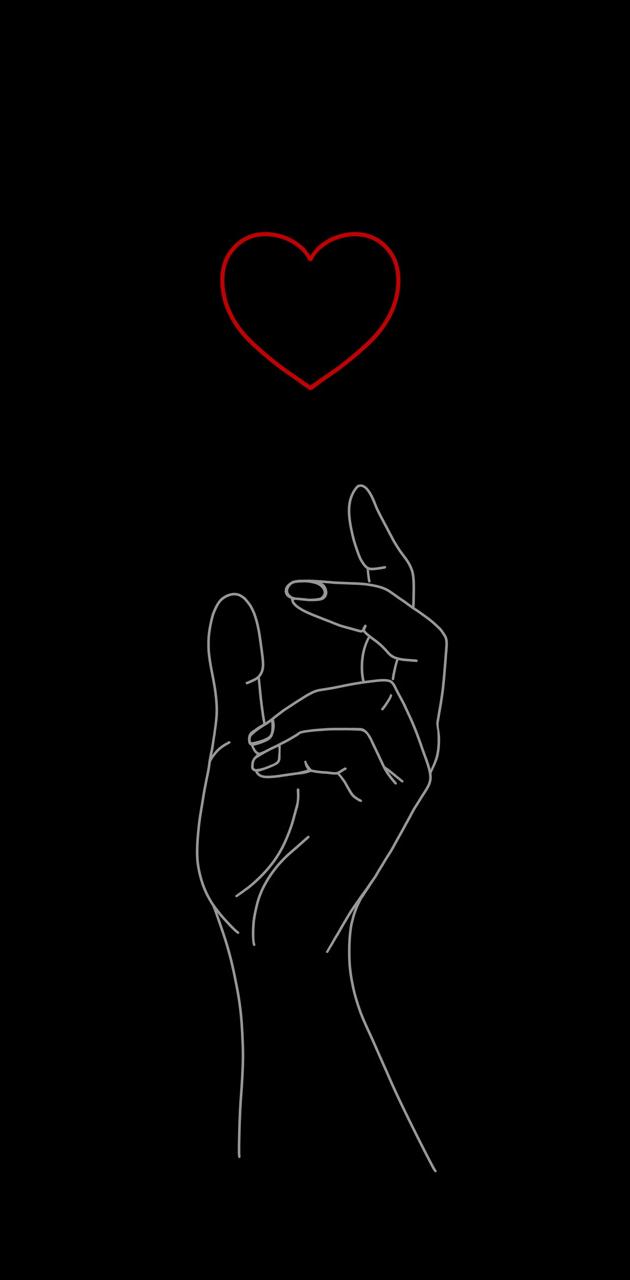 A hand holding up the heart in black and white - Valentine's Day