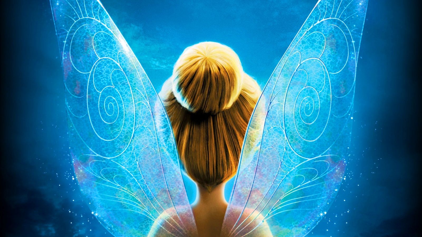 Tinker Bell is a fairy with blonde hair and blue wings. - Tinkerbell