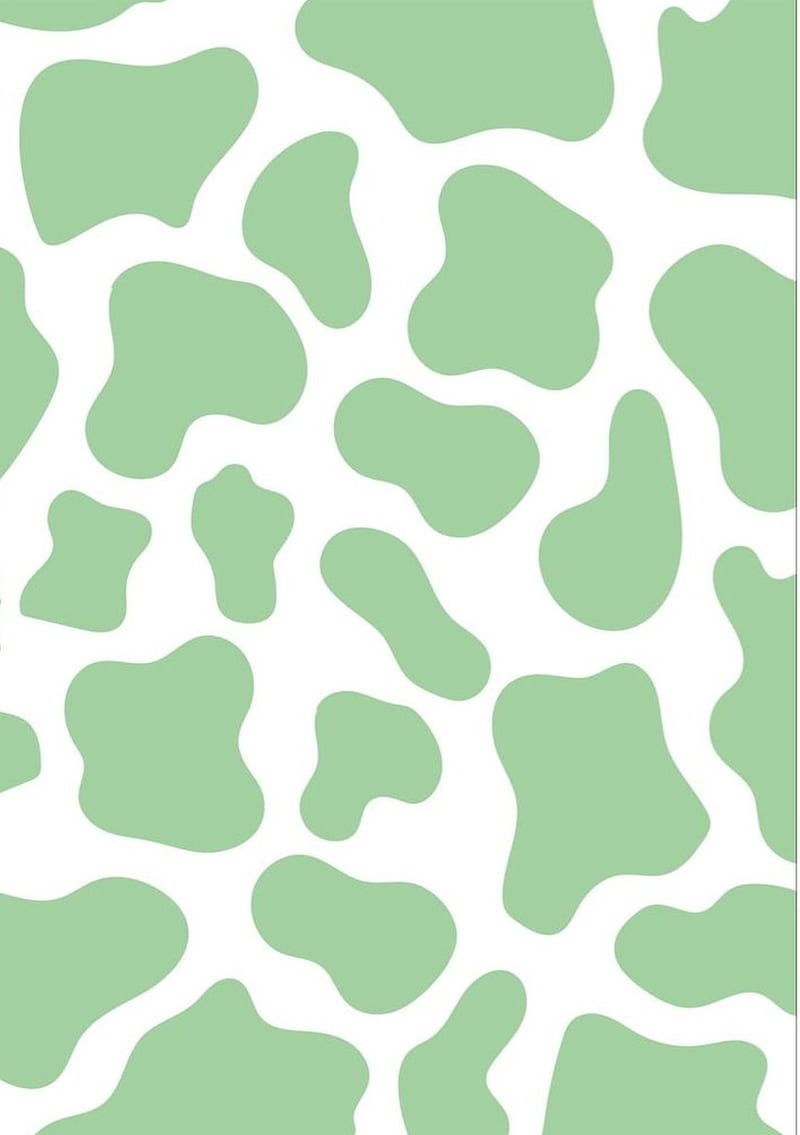 A green and white patterned background - Cow
