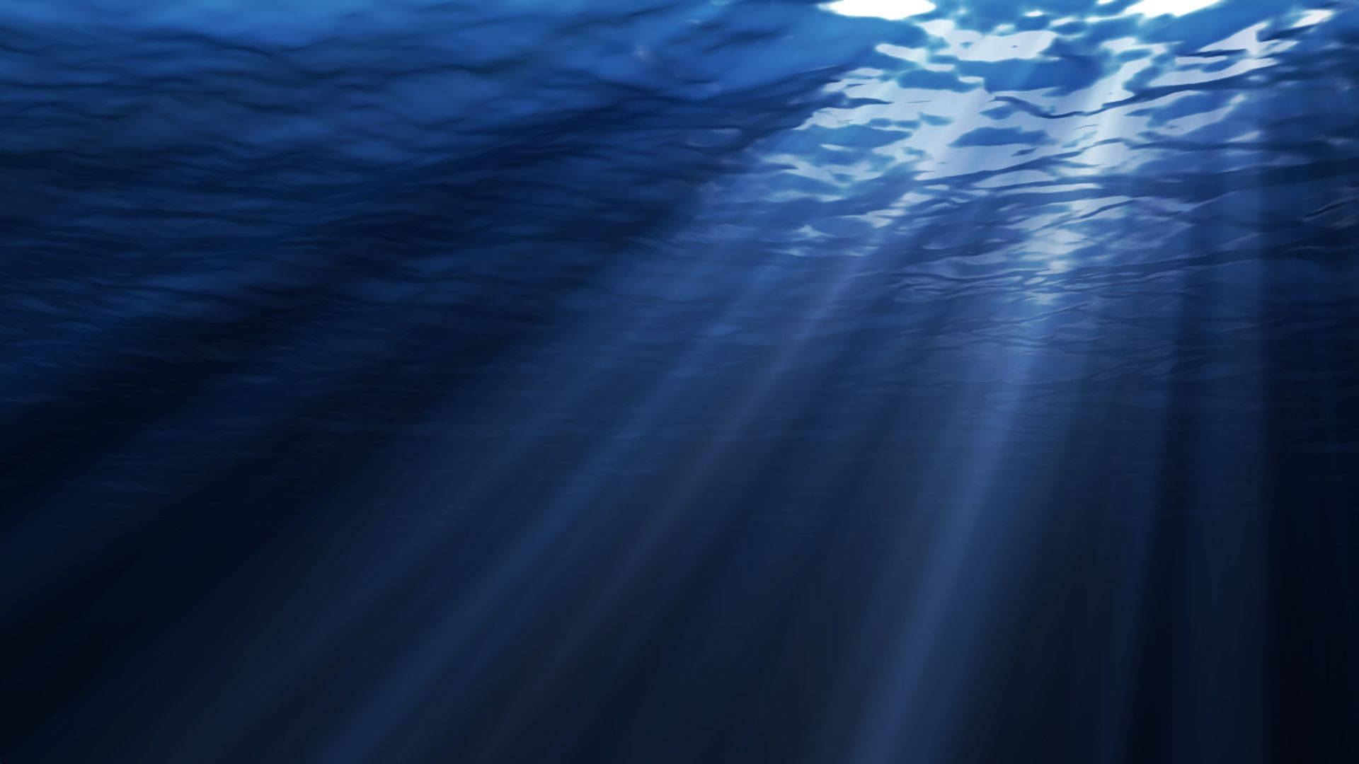 Download Sunlight Through Dark Underwater Wallpaper