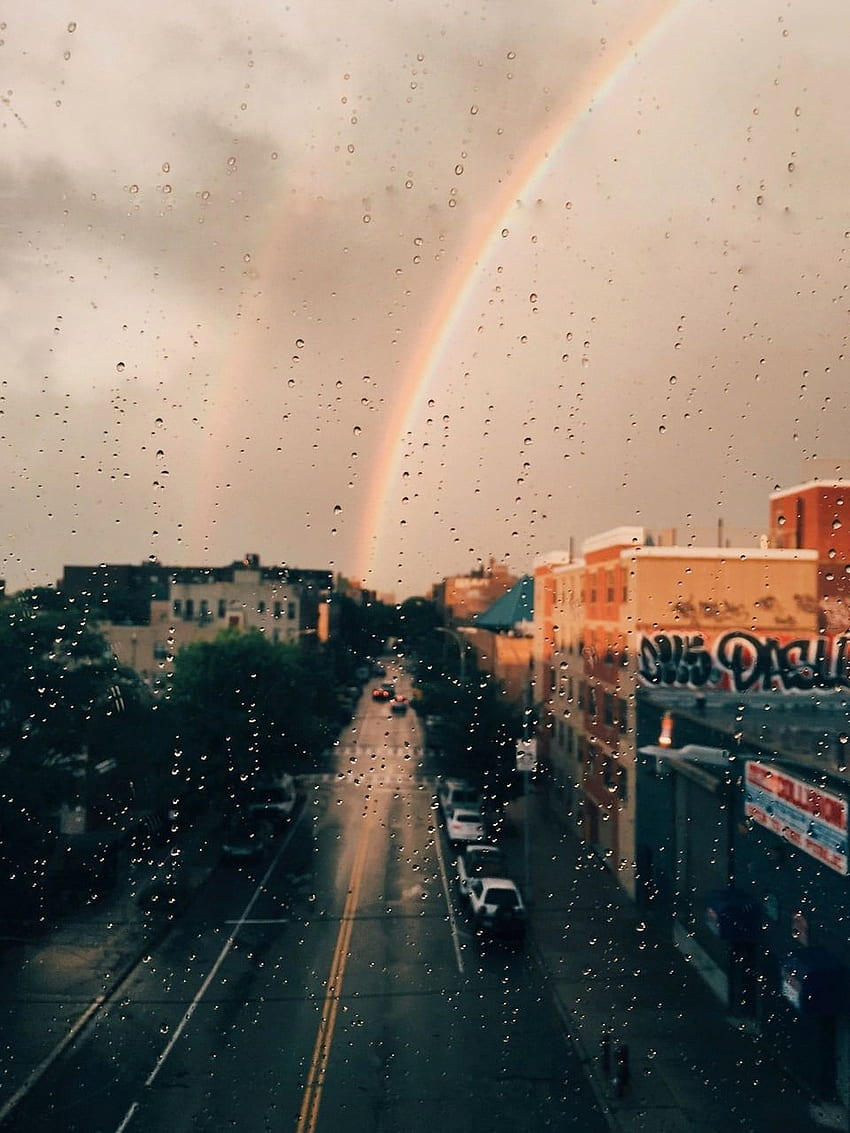 A rainbow is seen in the sky - Rain