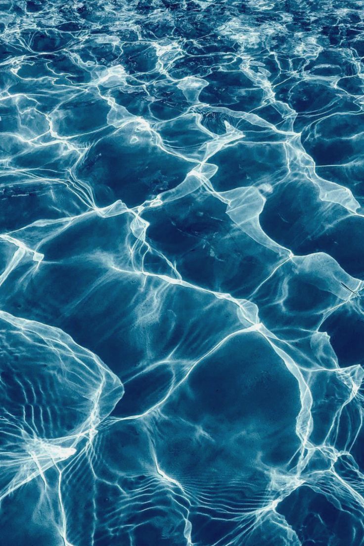The surface of a pool with water ripples - Underwater, water