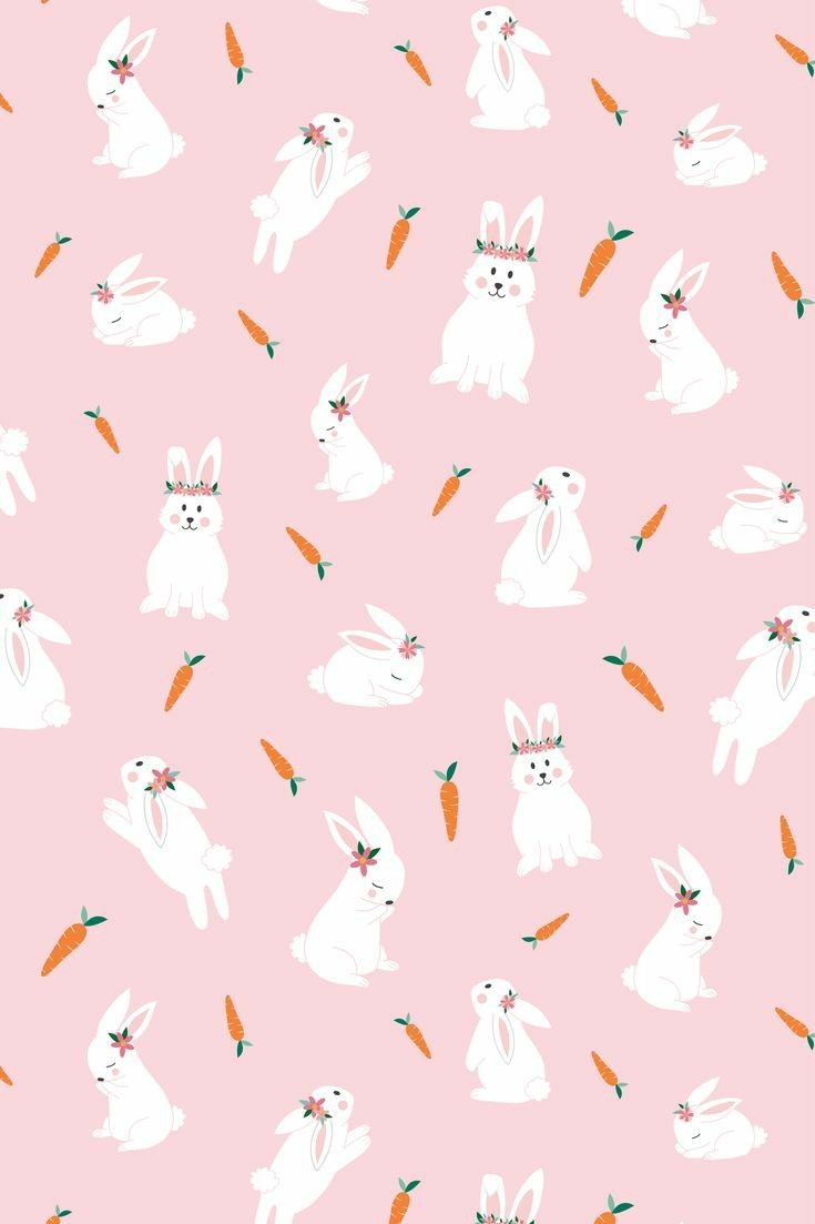White rabbits and carrots on a pink background - Easter