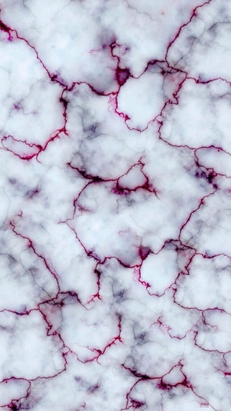 A close up of marble with red and white streaks - Marble