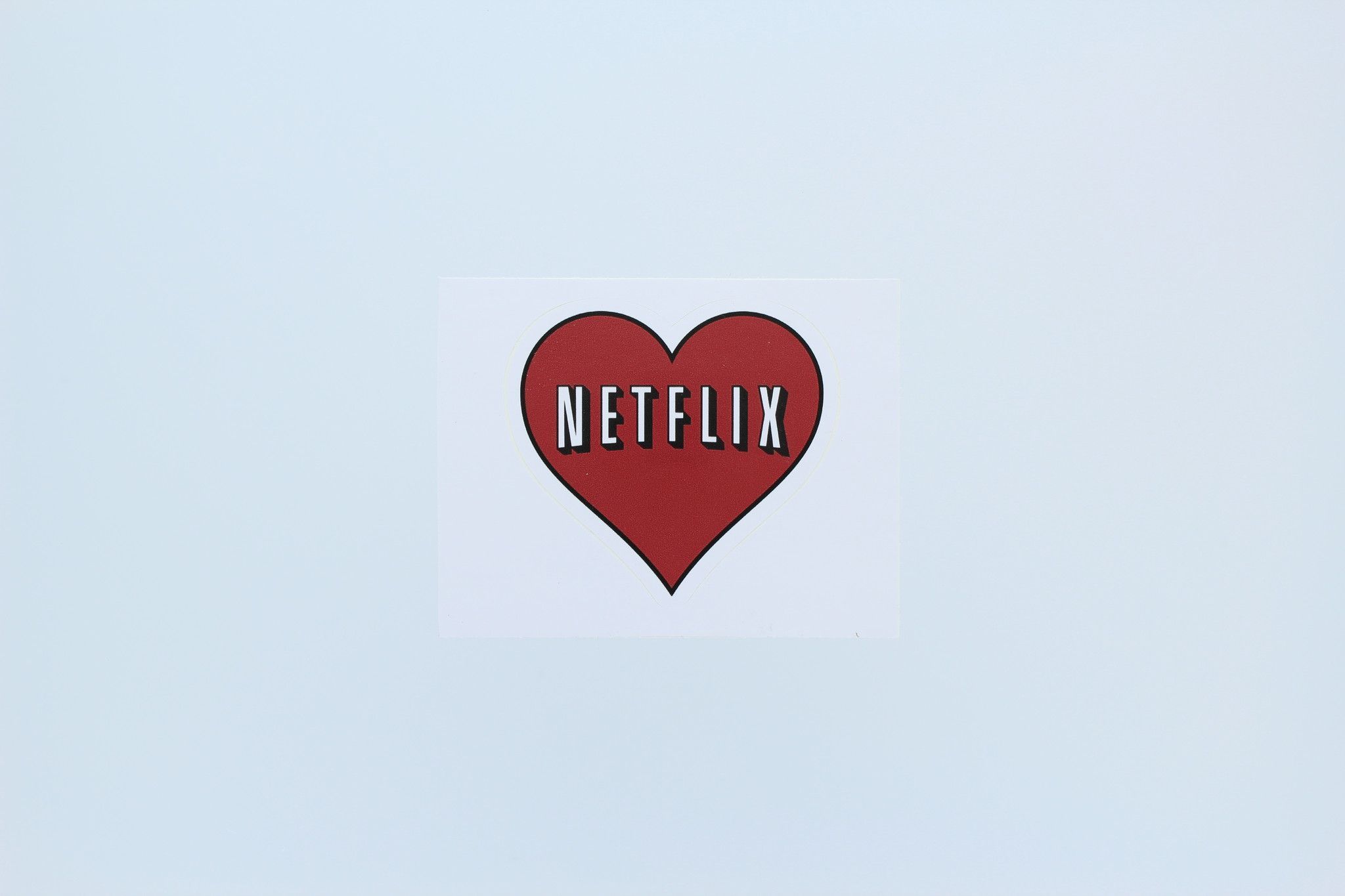 A heart shaped logo with the word netflix on it - Netflix