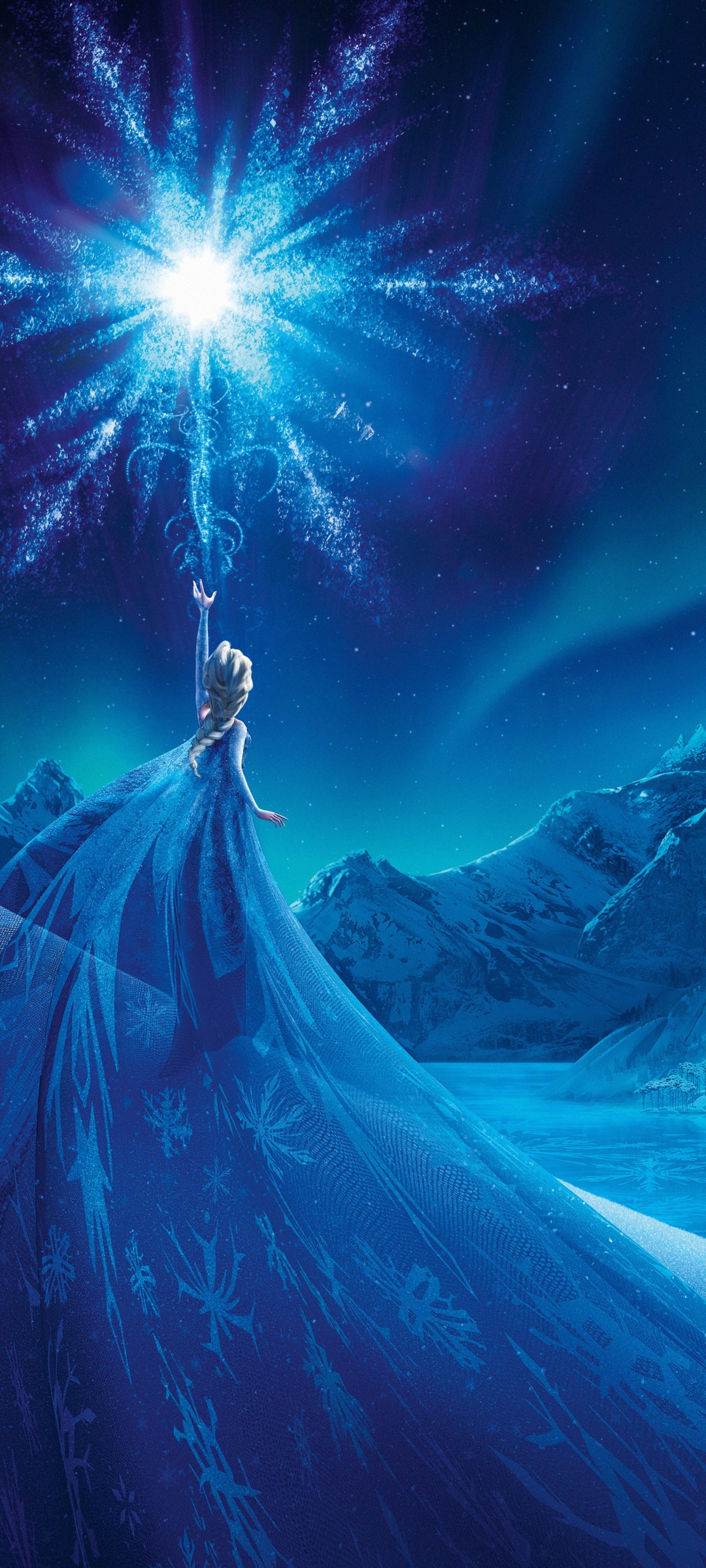 A woman dressed in blue is standing on top of the mountain - Elsa