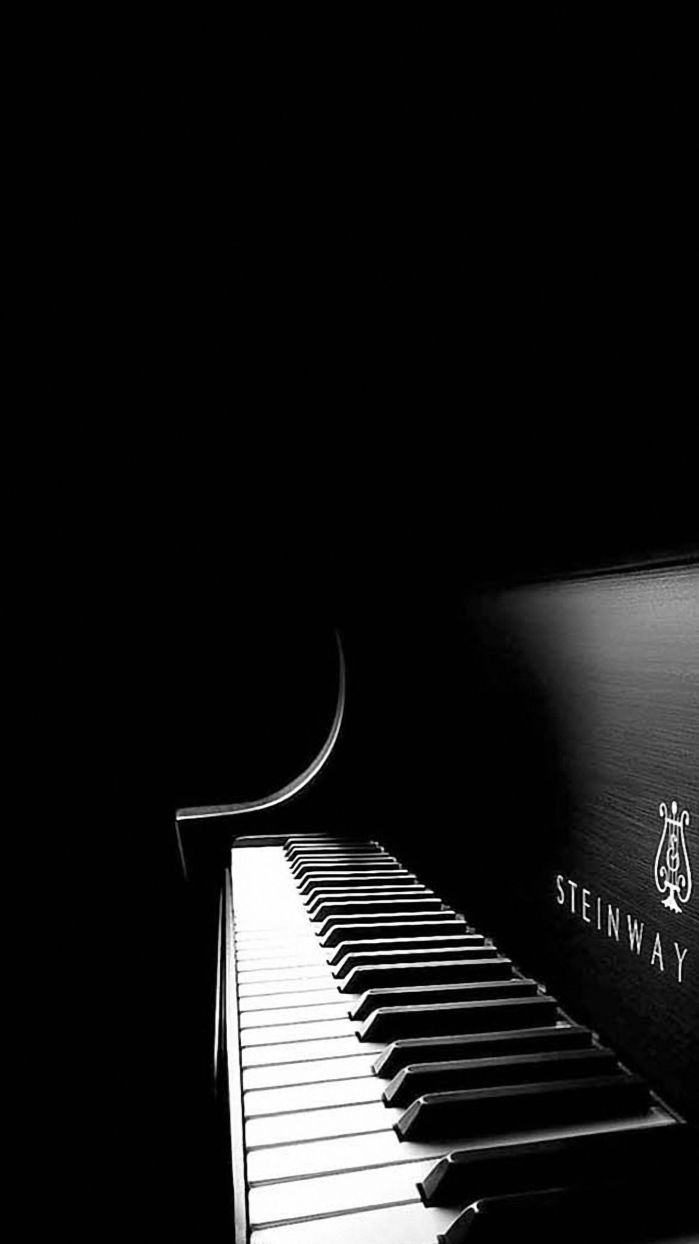 A black and white photo of an old piano - Piano