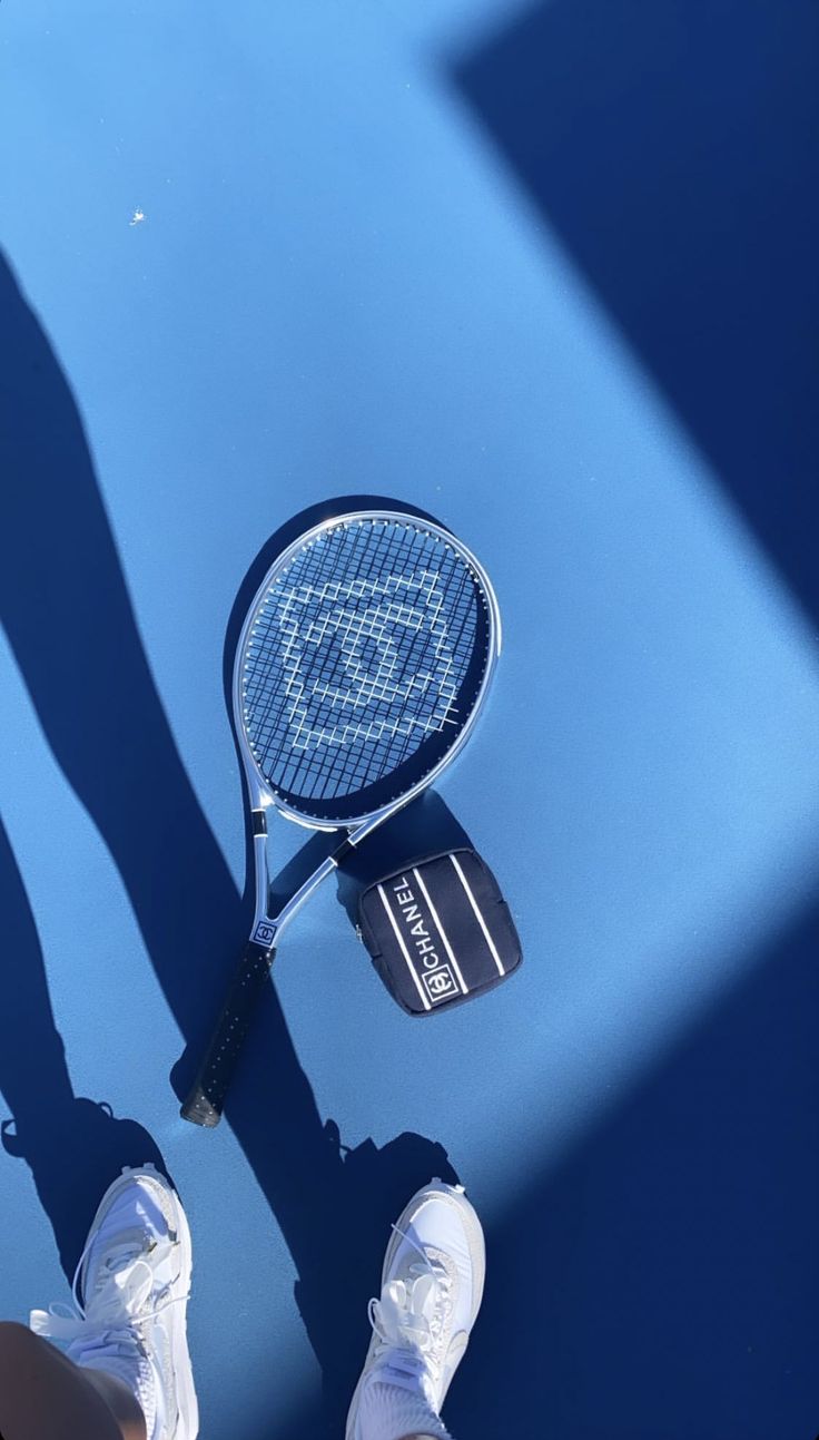 A tennis racket on a blue tennis court - Tennis