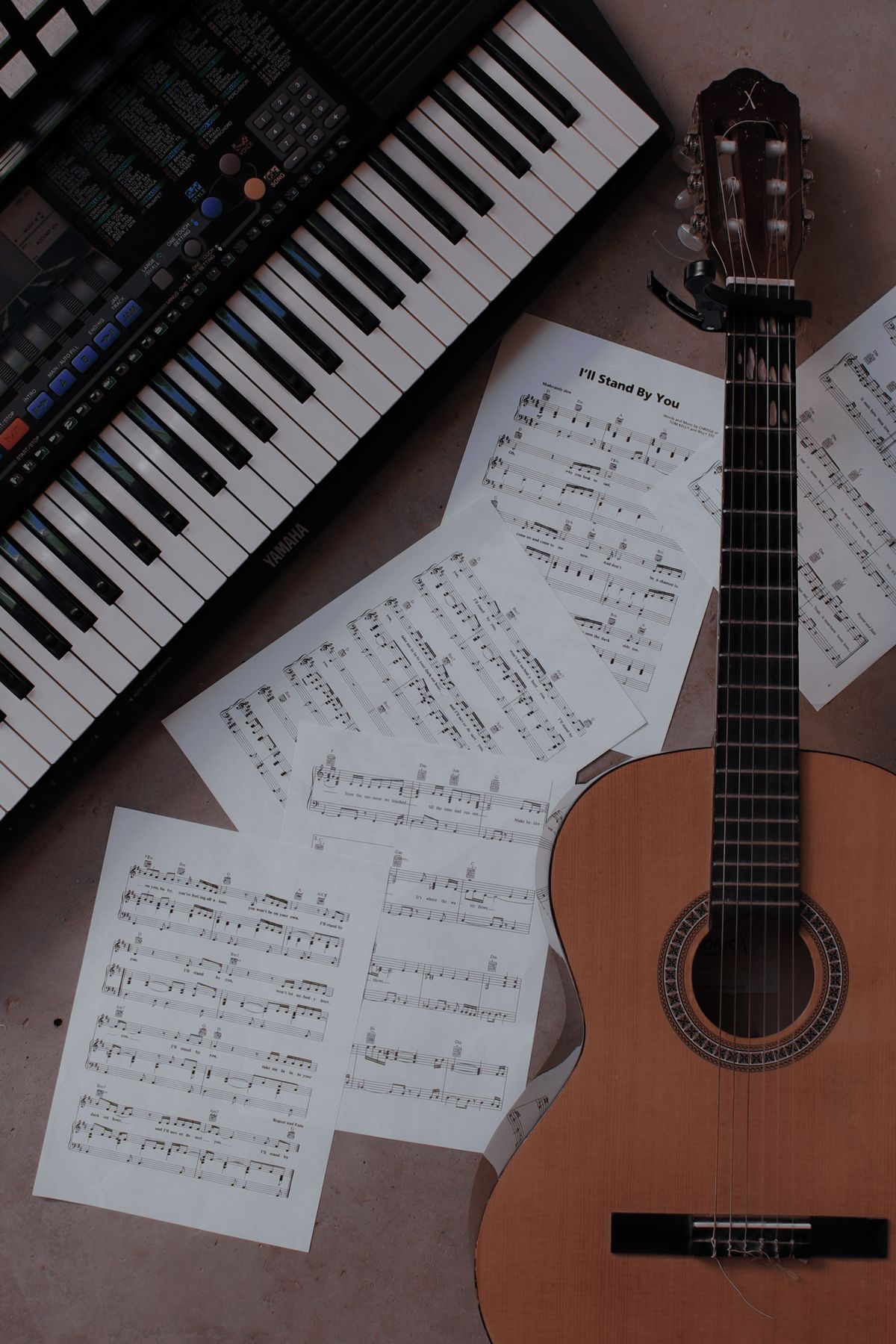 Sheet music, a guitar, and a keyboard - Piano, guitar