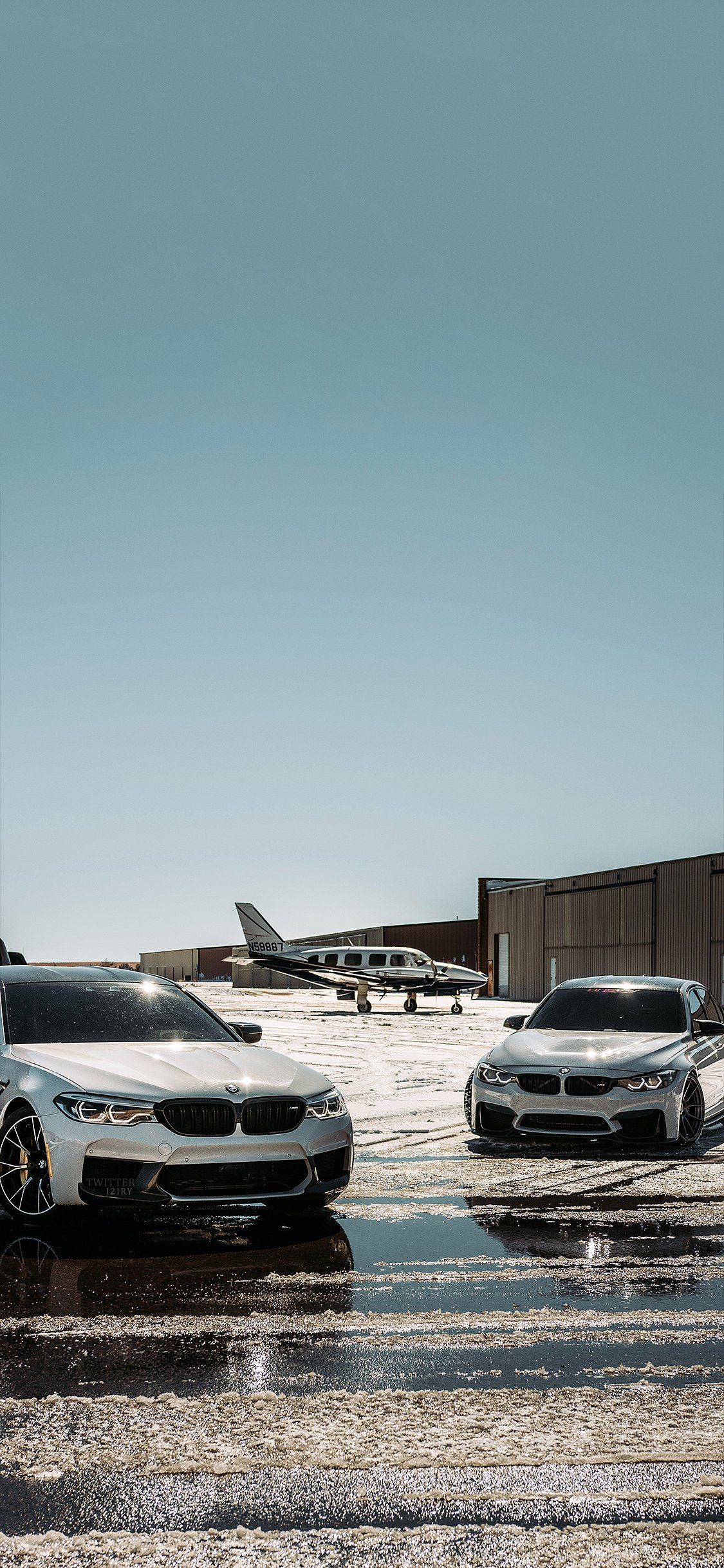 A couple of cars parked next to each other - BMW, cars