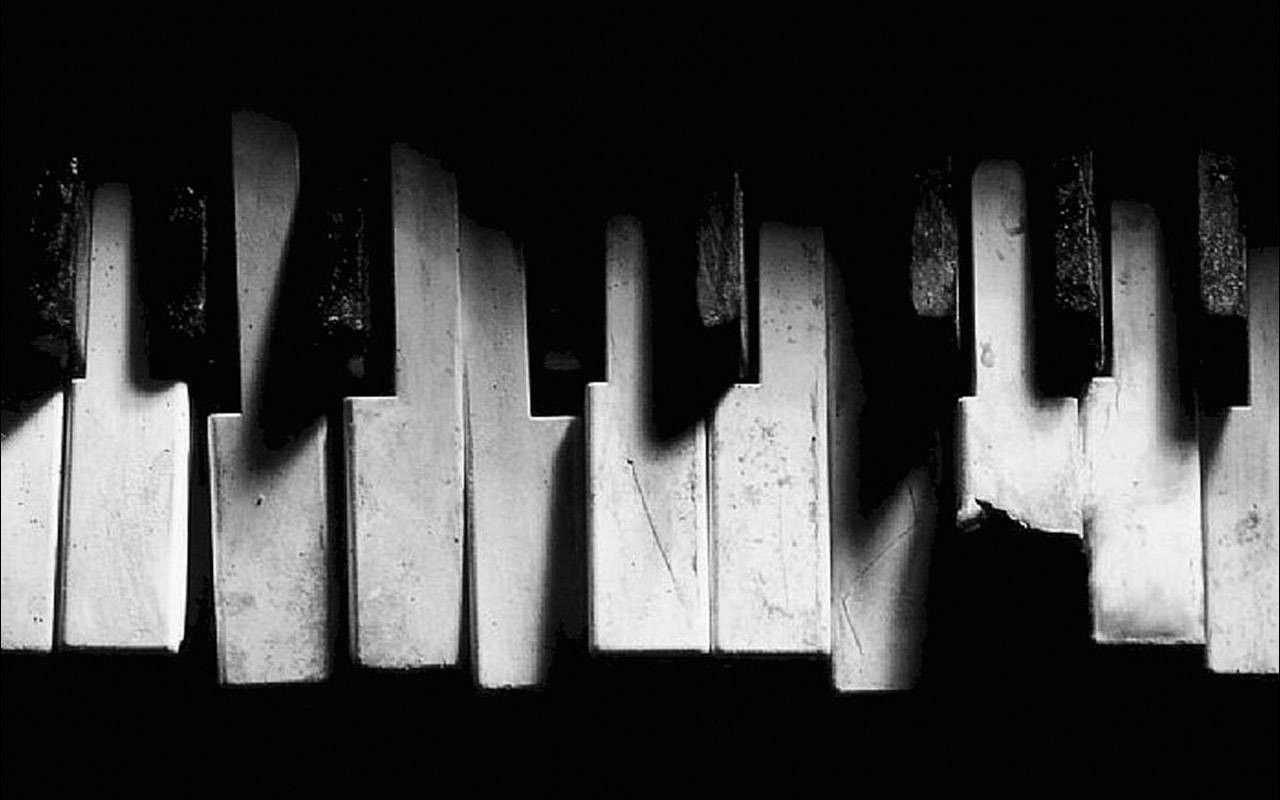 A black and white photo of a piano keyboard. - Piano