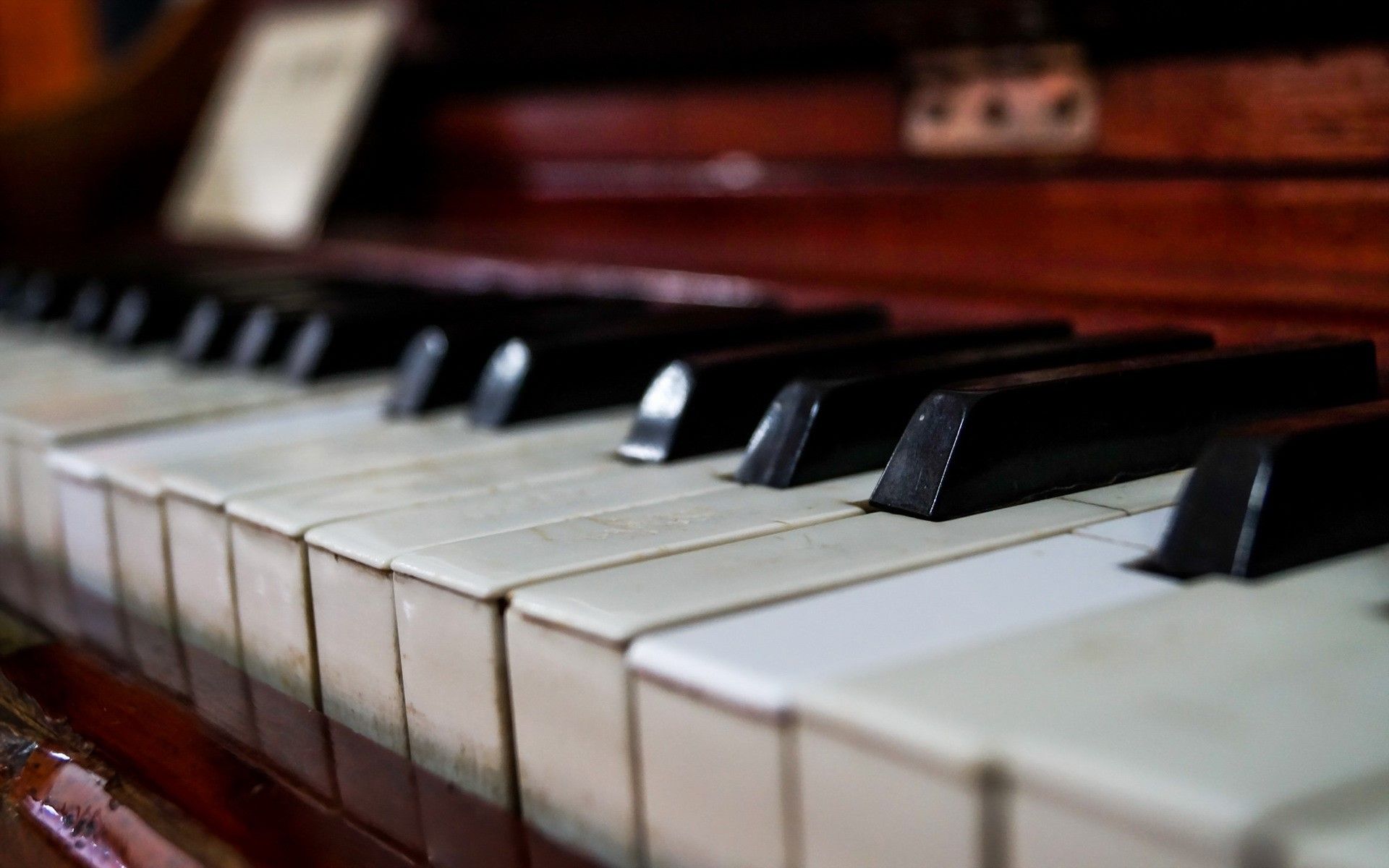 A close up of an old piano - Piano