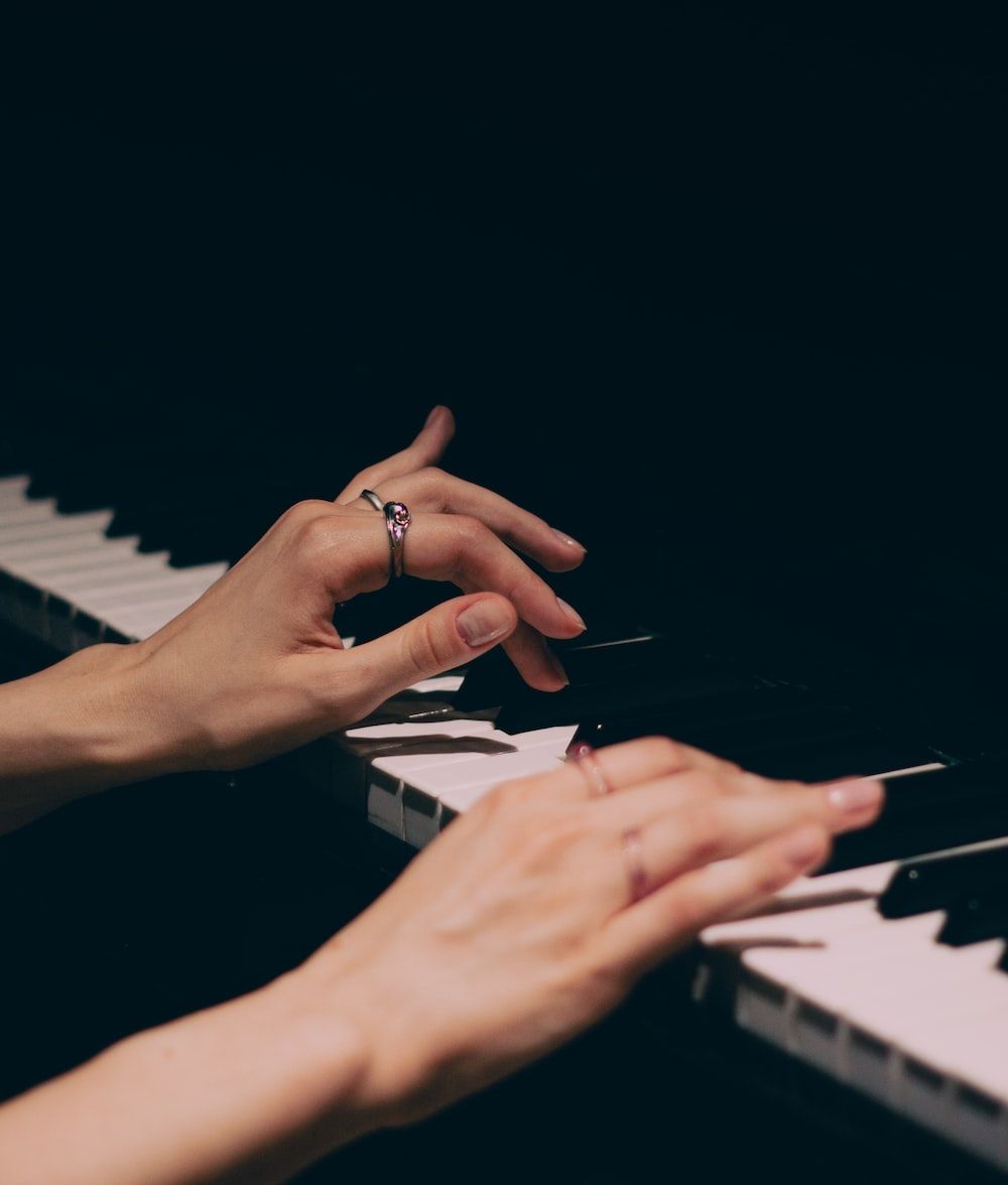 A woman's hands playing the piano - Piano