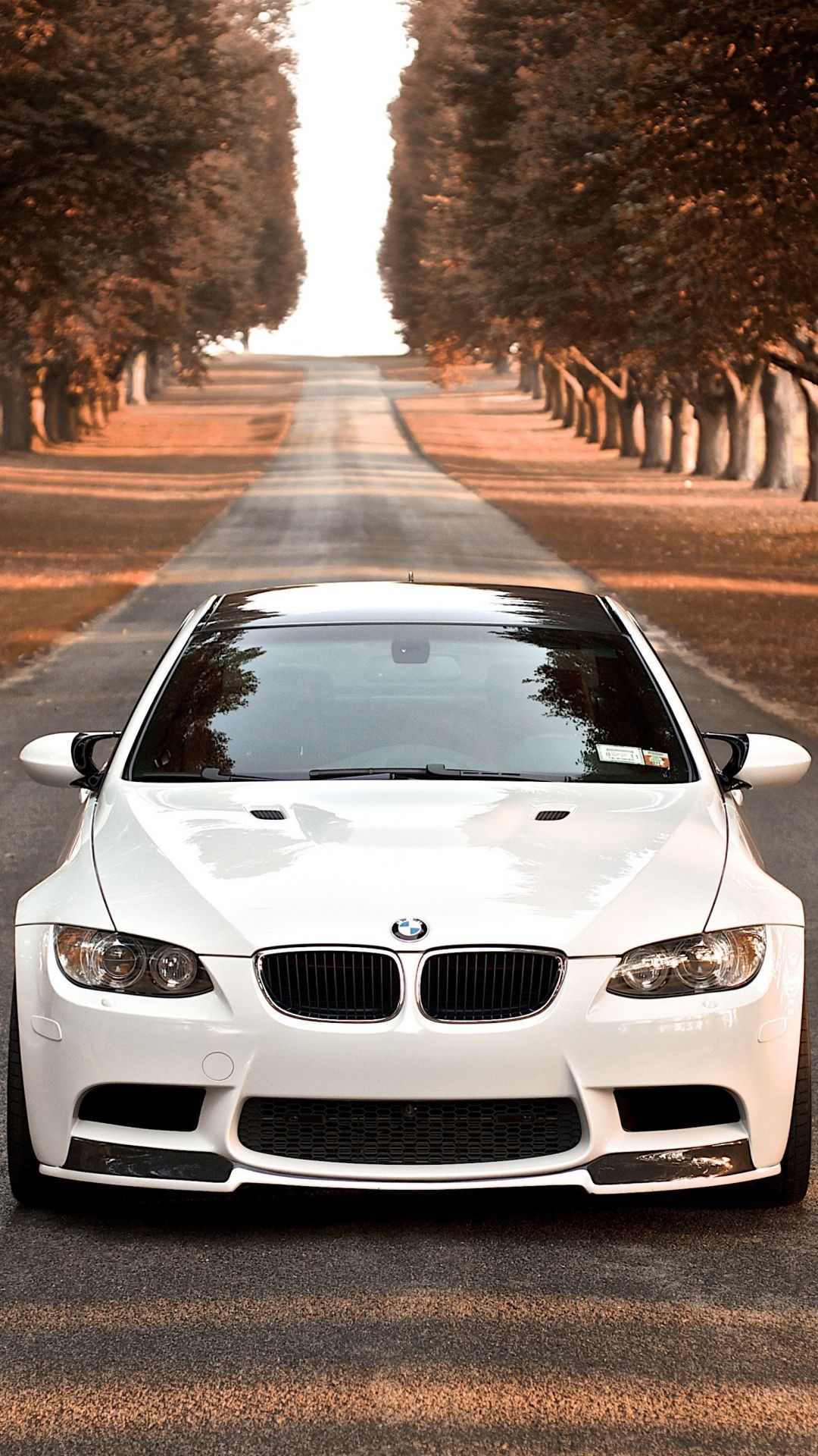 A white bmw car parked on the road - BMW