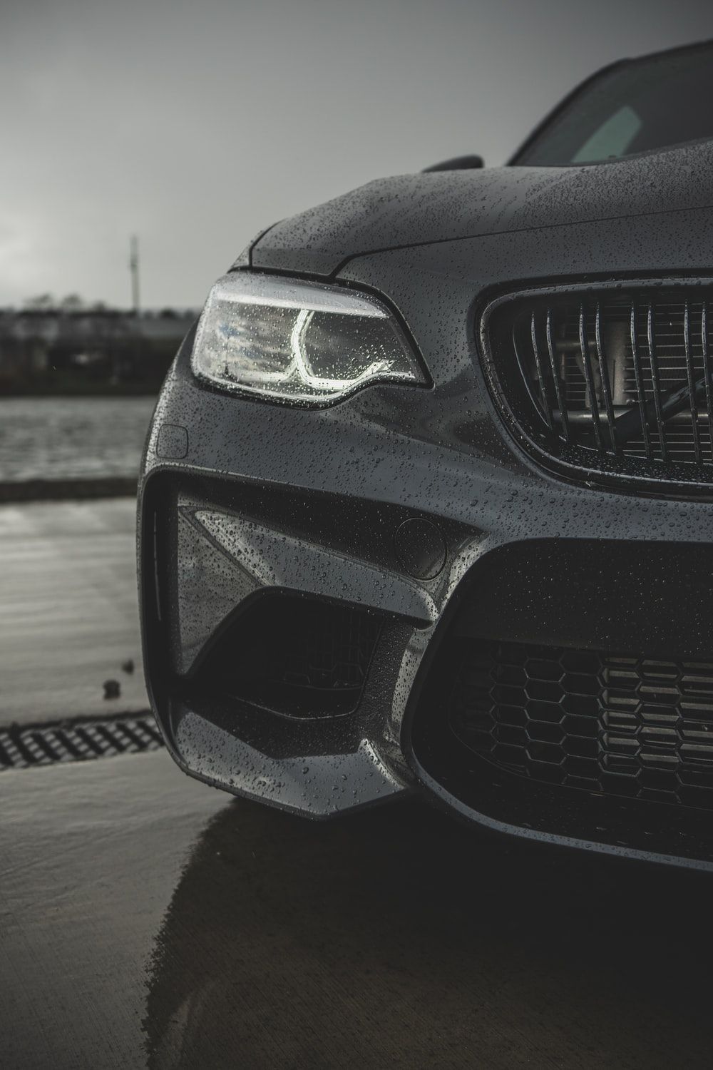 A black car parked by the river - BMW