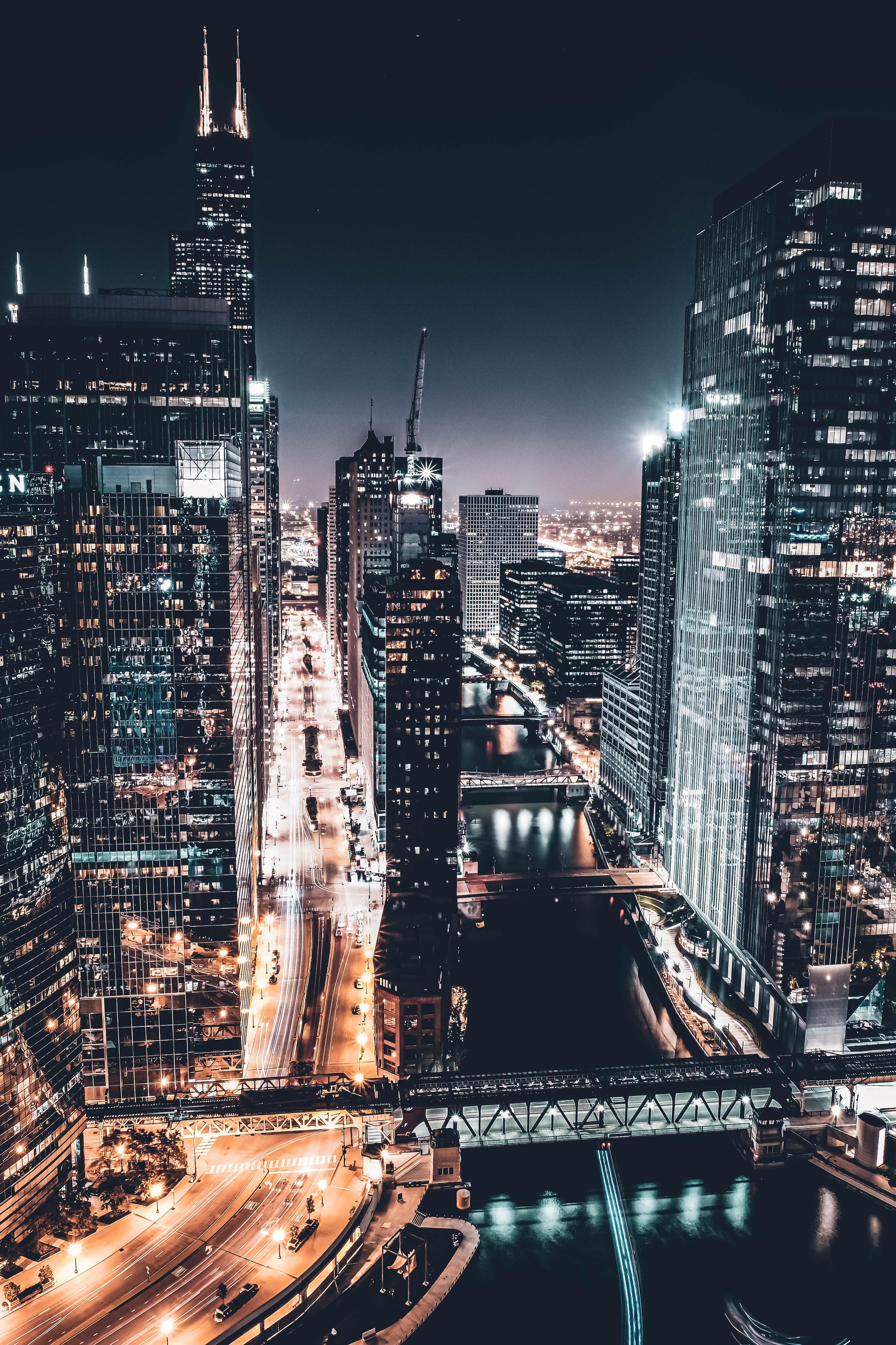 A city at night with many tall buildings - Chicago