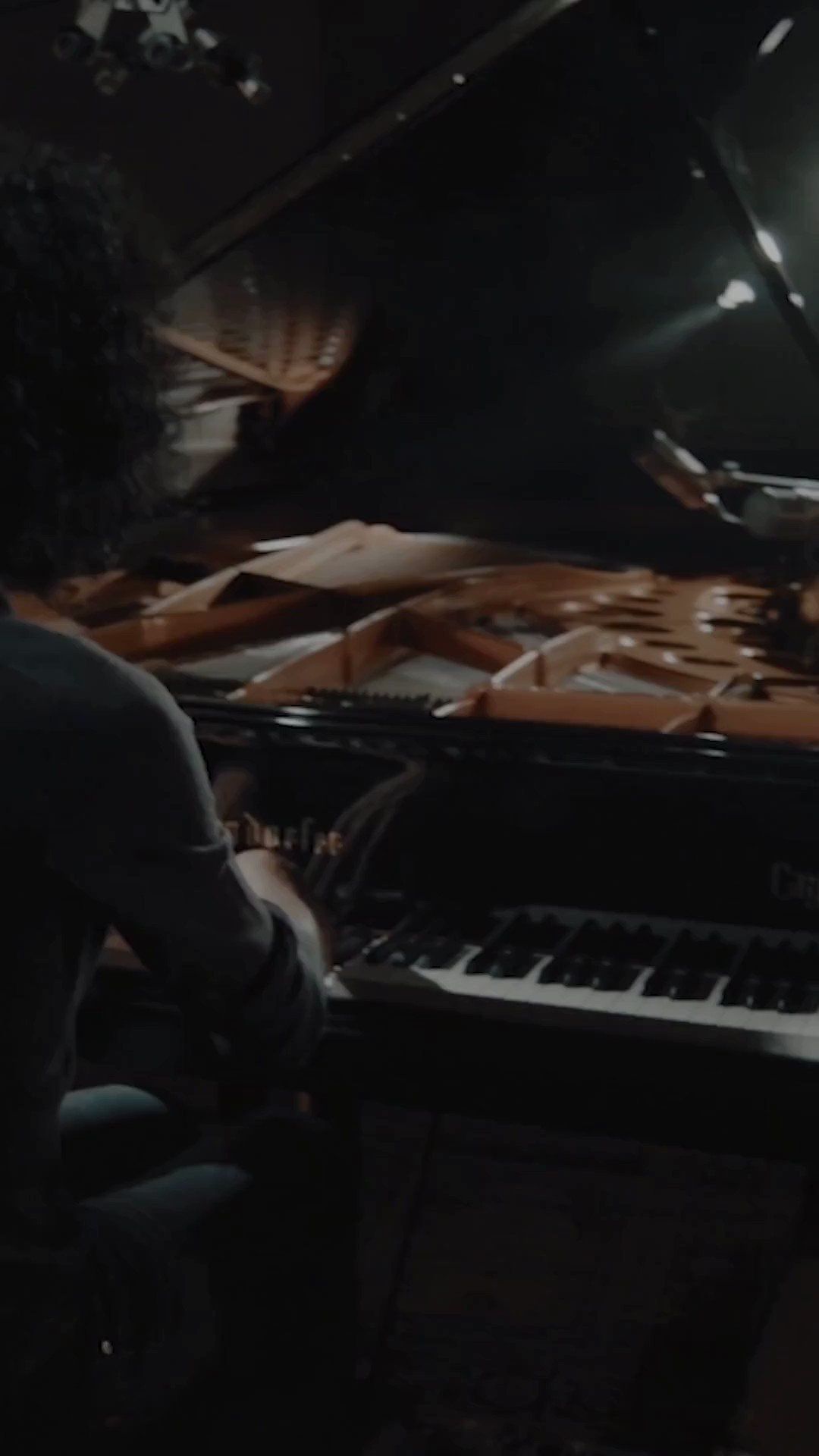 A man playing the piano in front of an audience - Piano