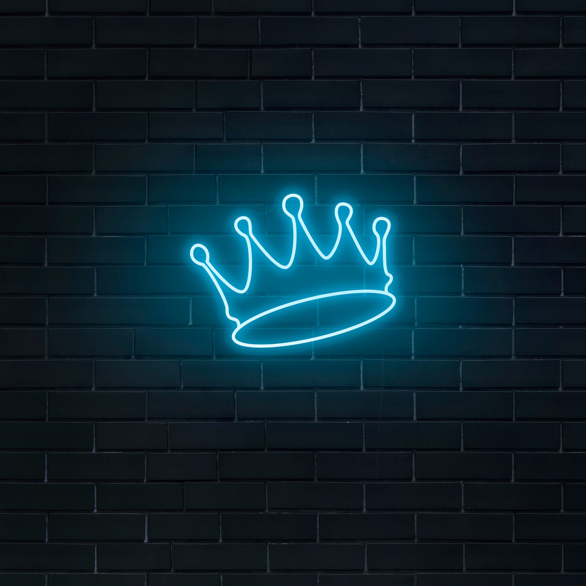 Neon sign of a crown on a brick wall - Neon blue
