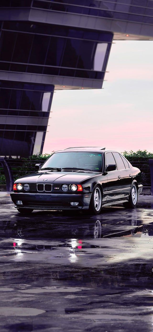 Aesthetic BMW parked on wet asphalt 4K wallpaper [2610x5655] and [1080x2340]