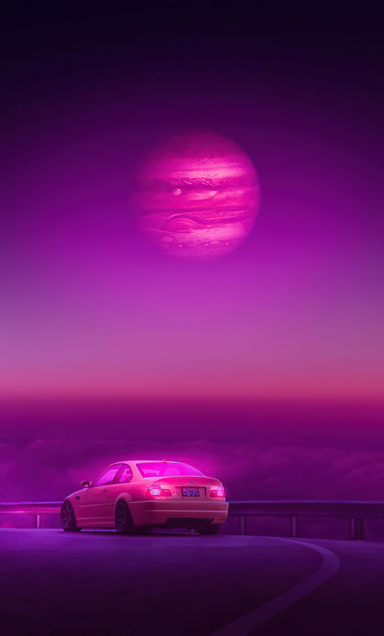 A car on a highway with a purple sky - BMW