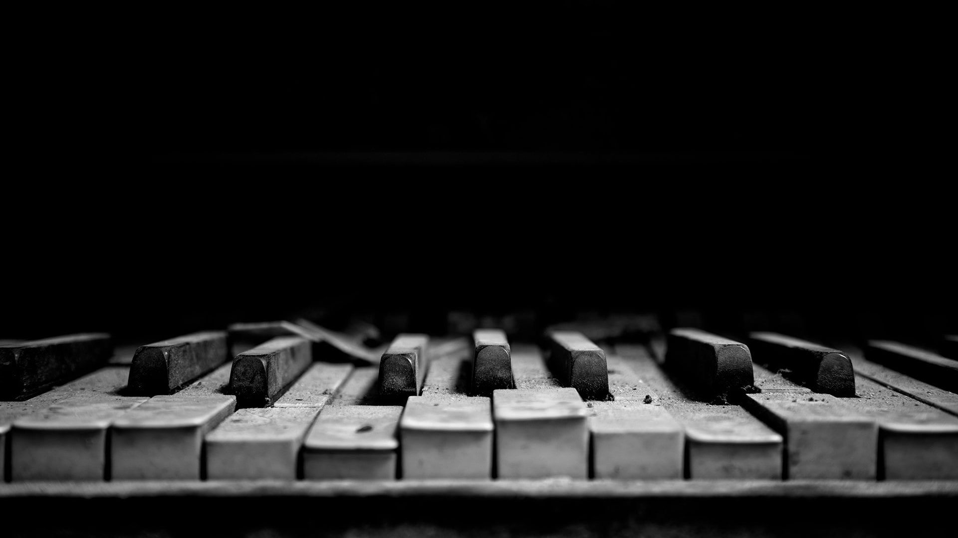 A close up of a piano keyboard in black and white. - Piano