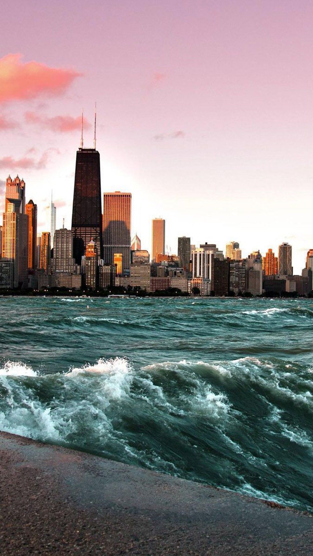 A city skyline with water and waves in the foreground - Chicago