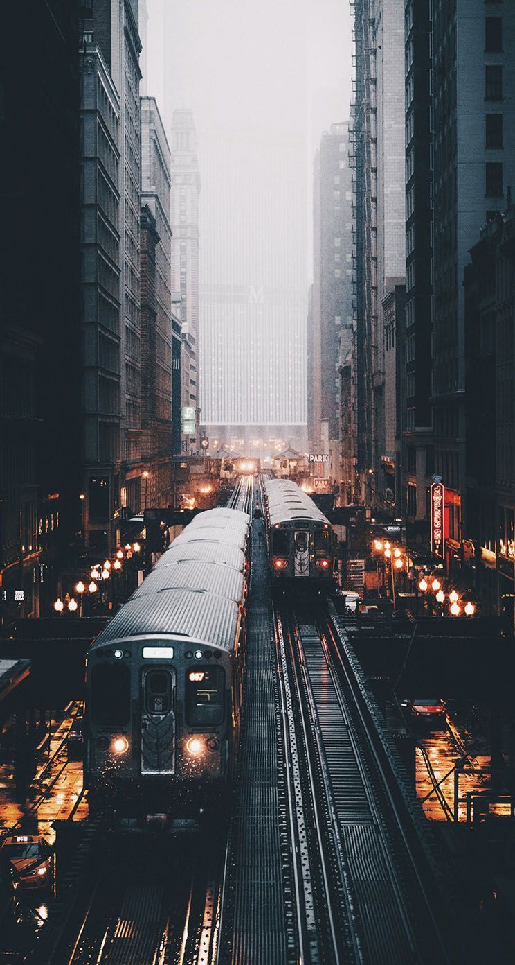 A train traveling down the tracks at night - Chicago