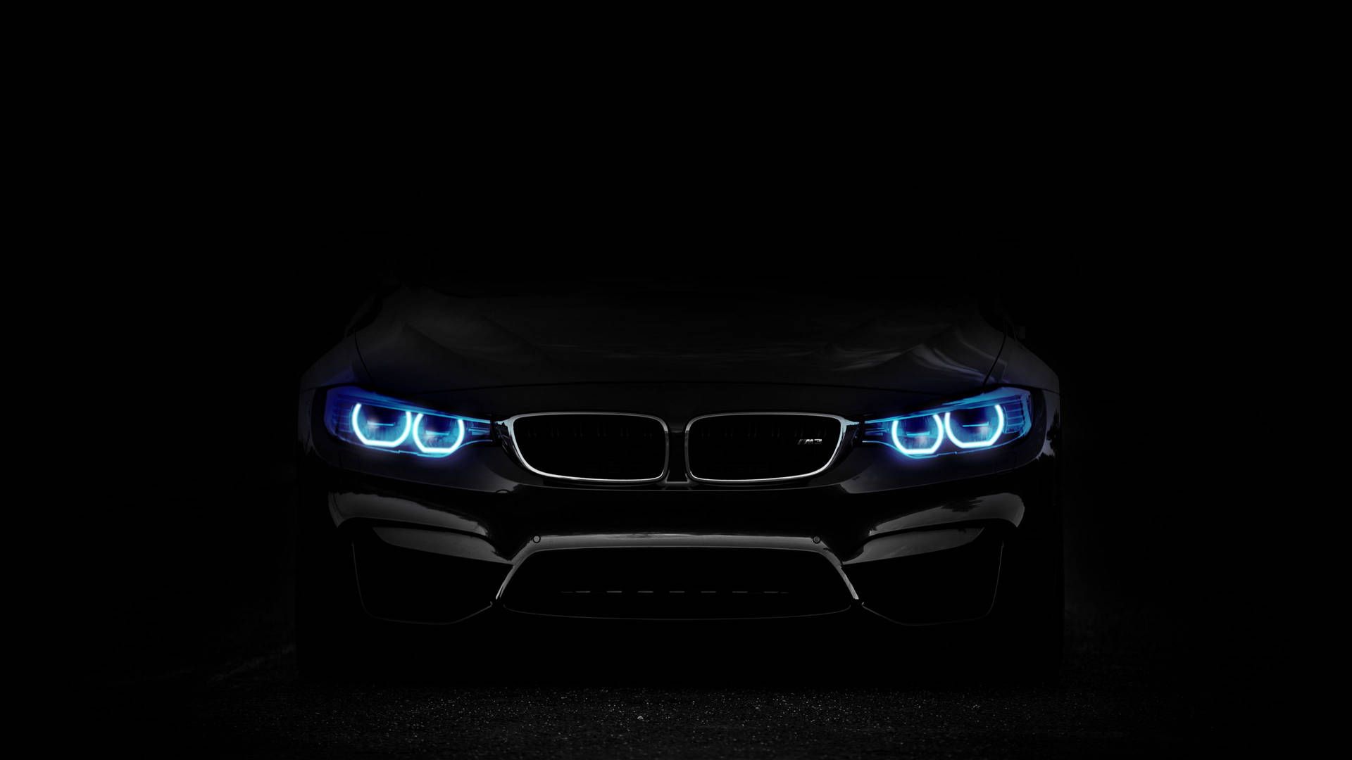 Black car with blue lights in the dark - BMW