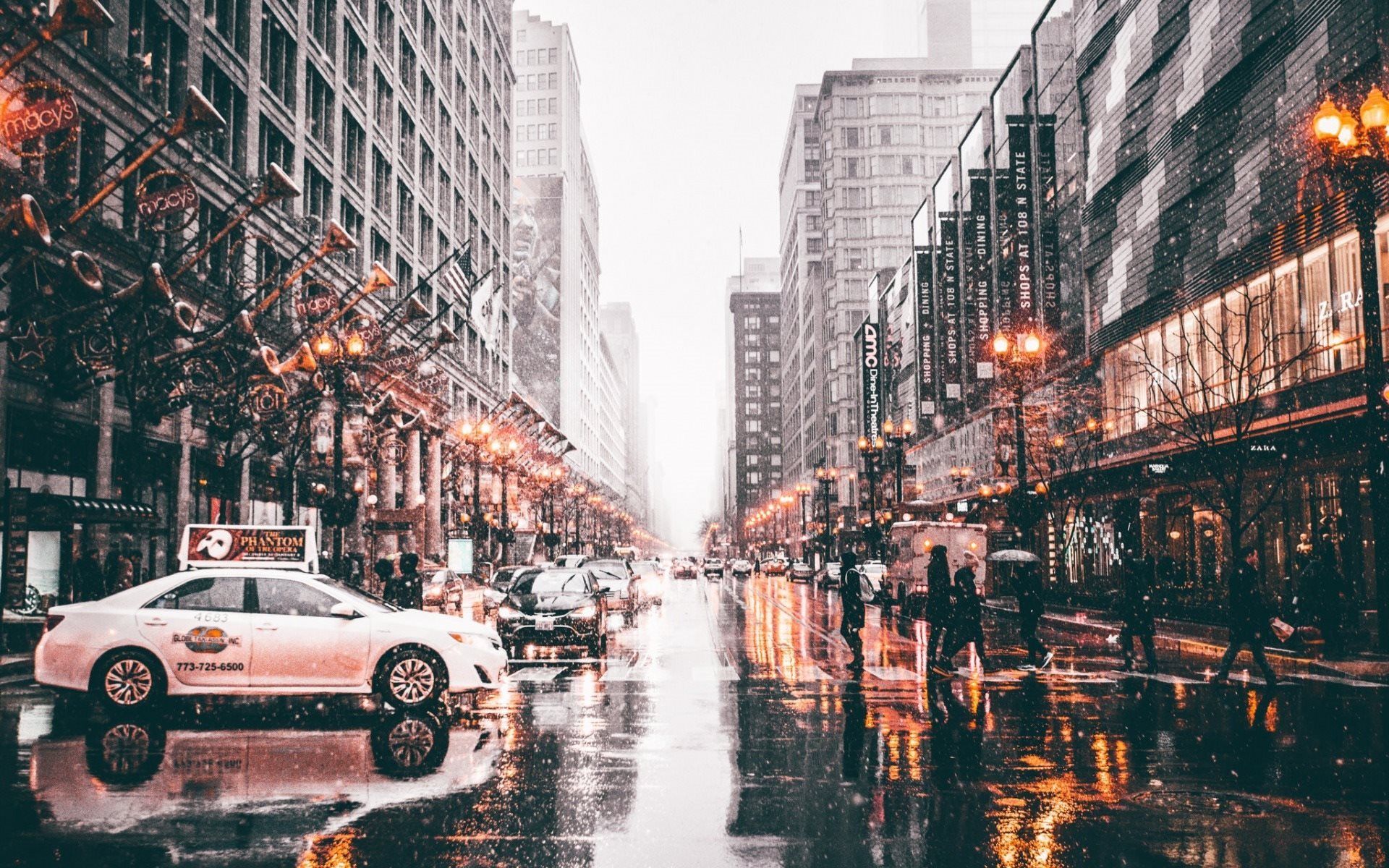 A city street with cars and people on a rainy day - Chicago