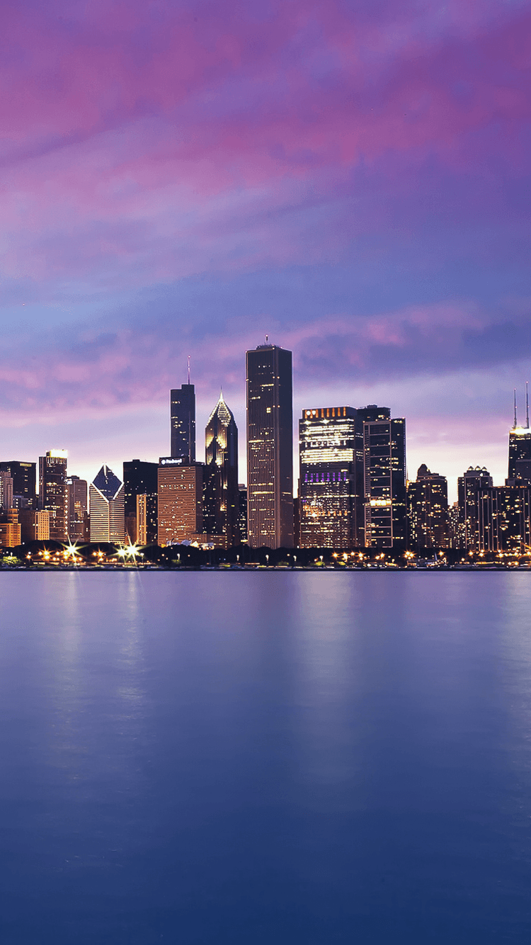 Chicago skyline at dusk with purple and blue hues in the sky - Chicago