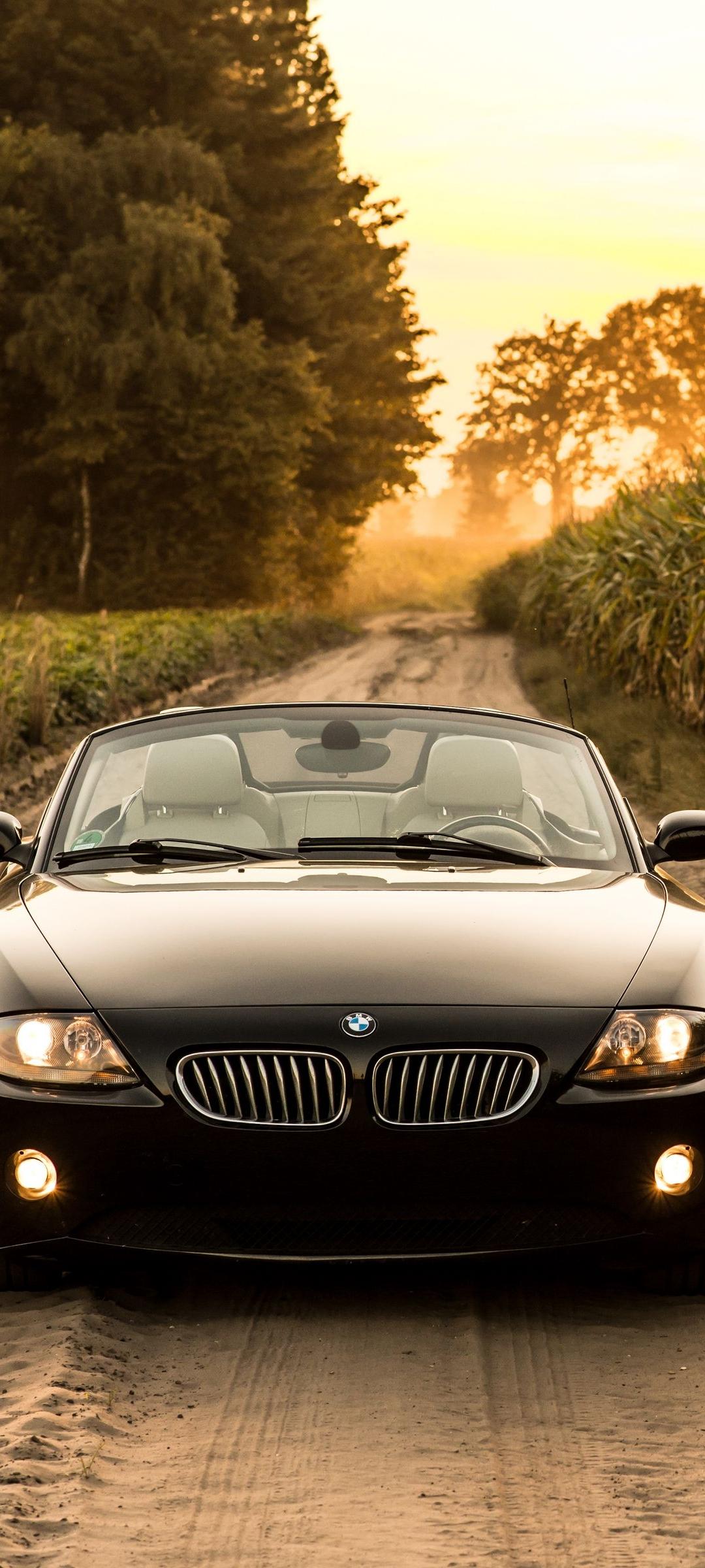 BMW Z4 on the road at sunset - BMW