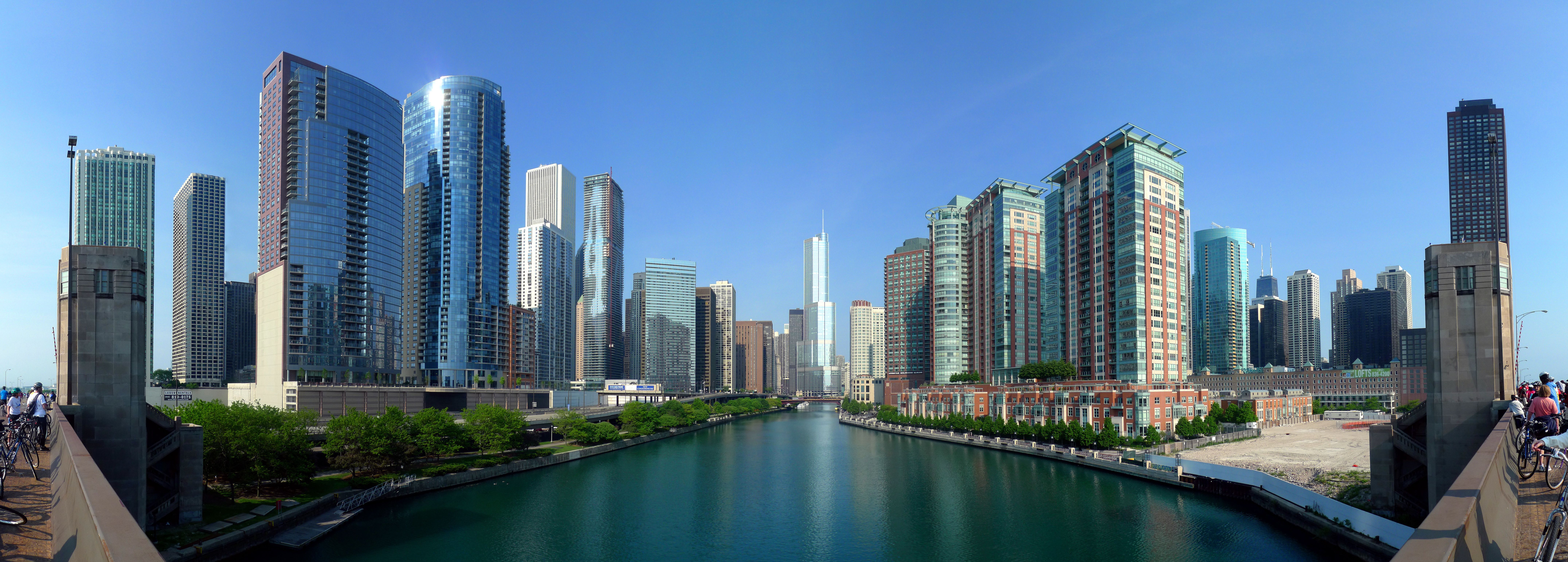 A river runs through the city, with tall buildings on either side. - Chicago