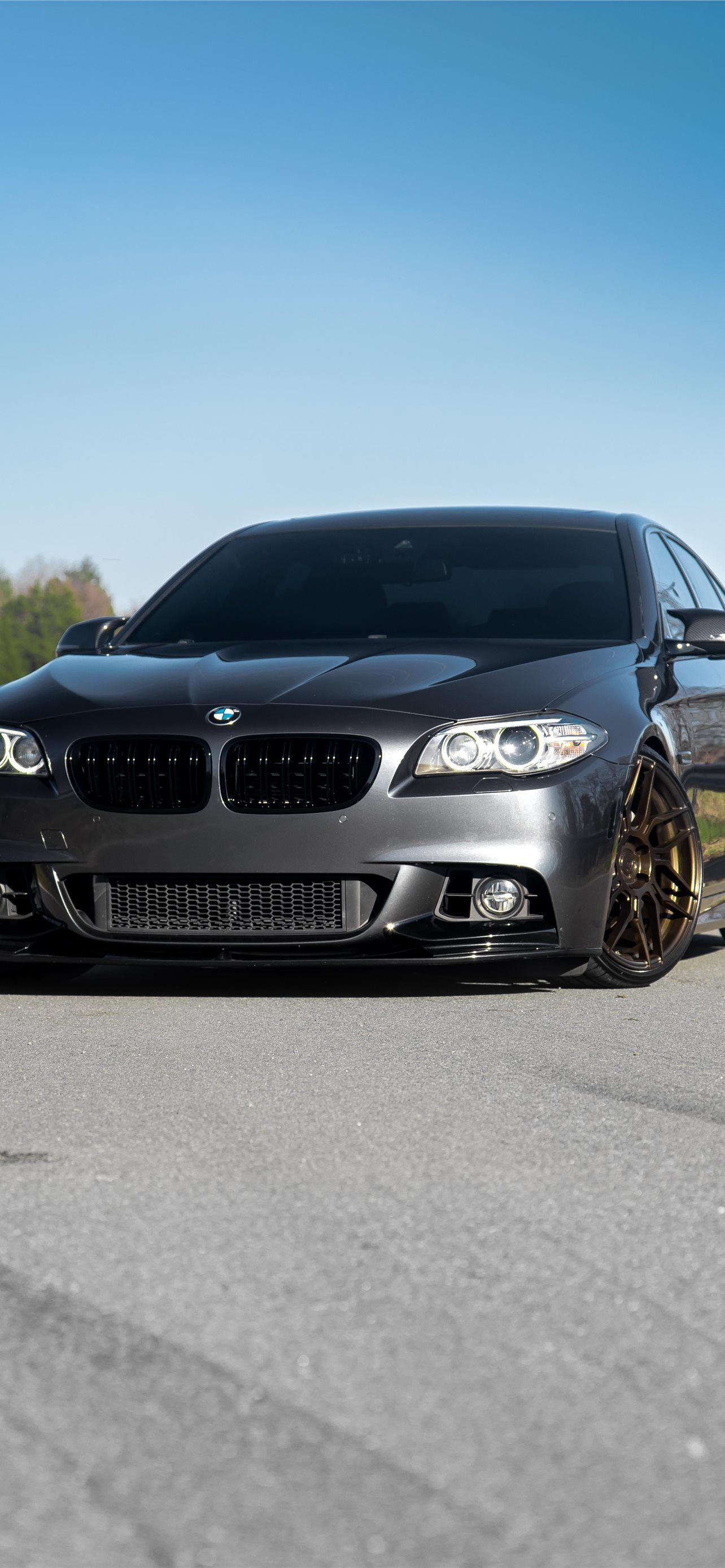 A car is parked on the side of road - BMW