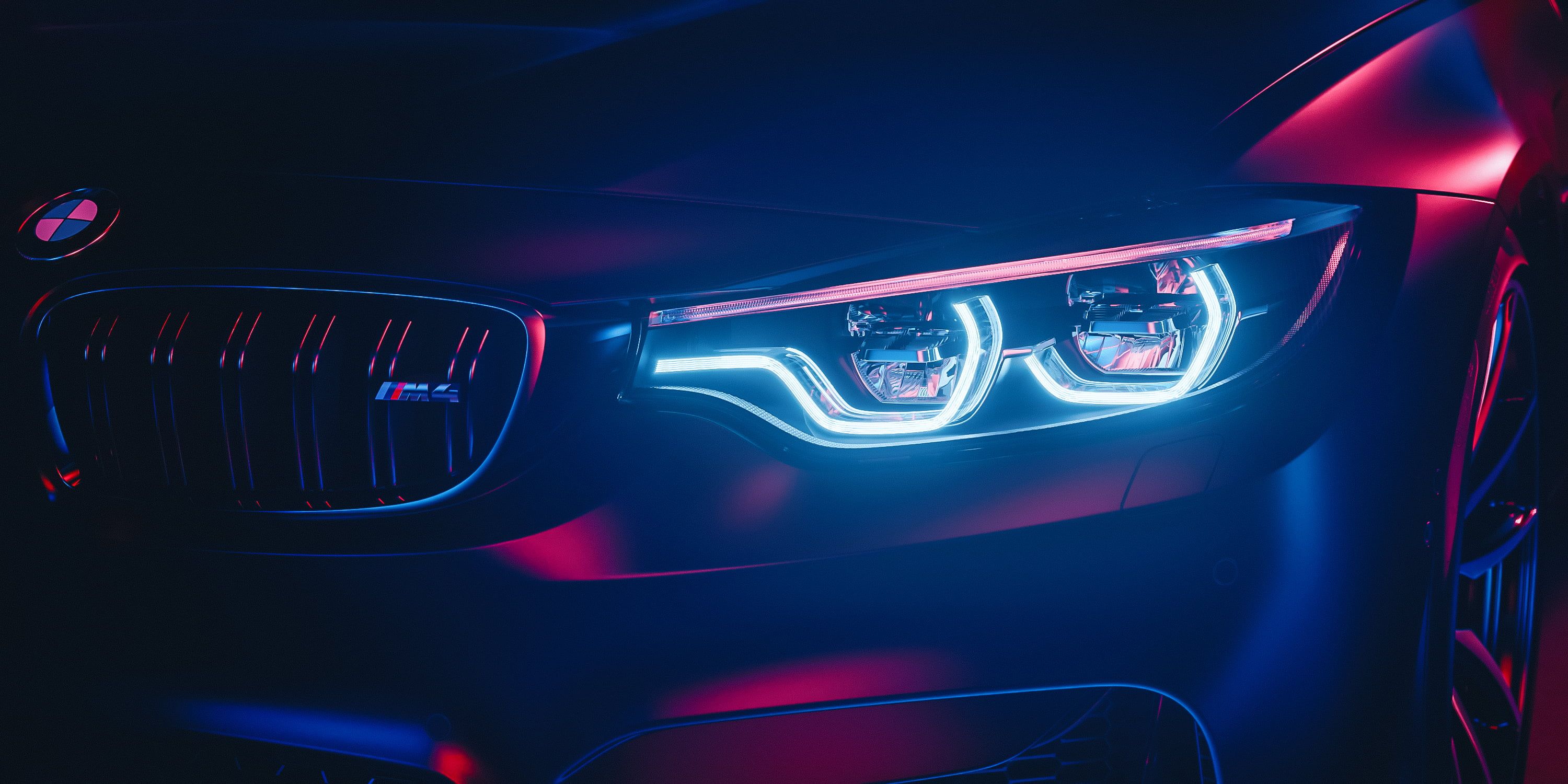 A close up of the headlights on an automobile - BMW