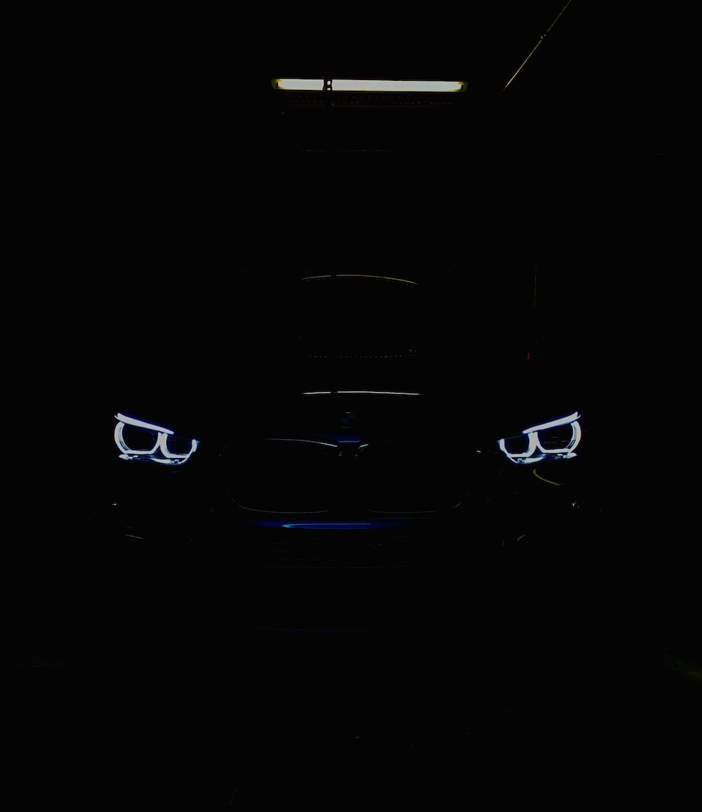 A car is parked in the dark - BMW