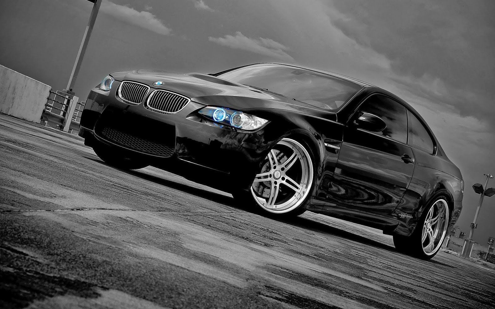 Black and white photo of a BMW M3 on a parking lot - BMW
