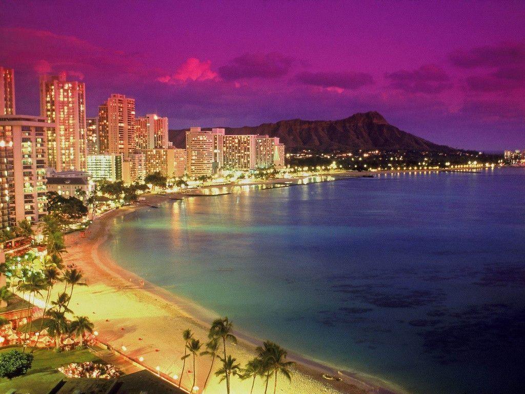 The beautiful city of Honolulu, Hawaii, is lit up at night. - Miami