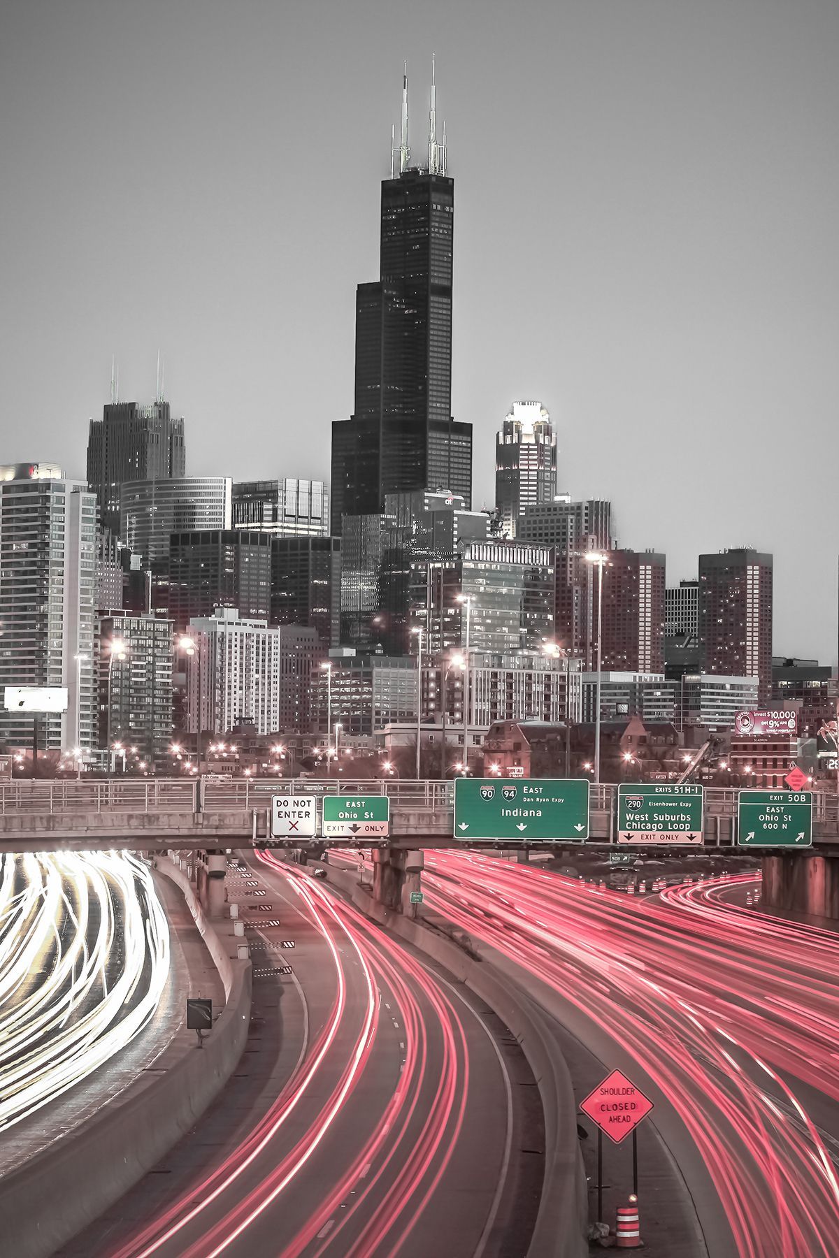 A city skyline with traffic and lights - Chicago