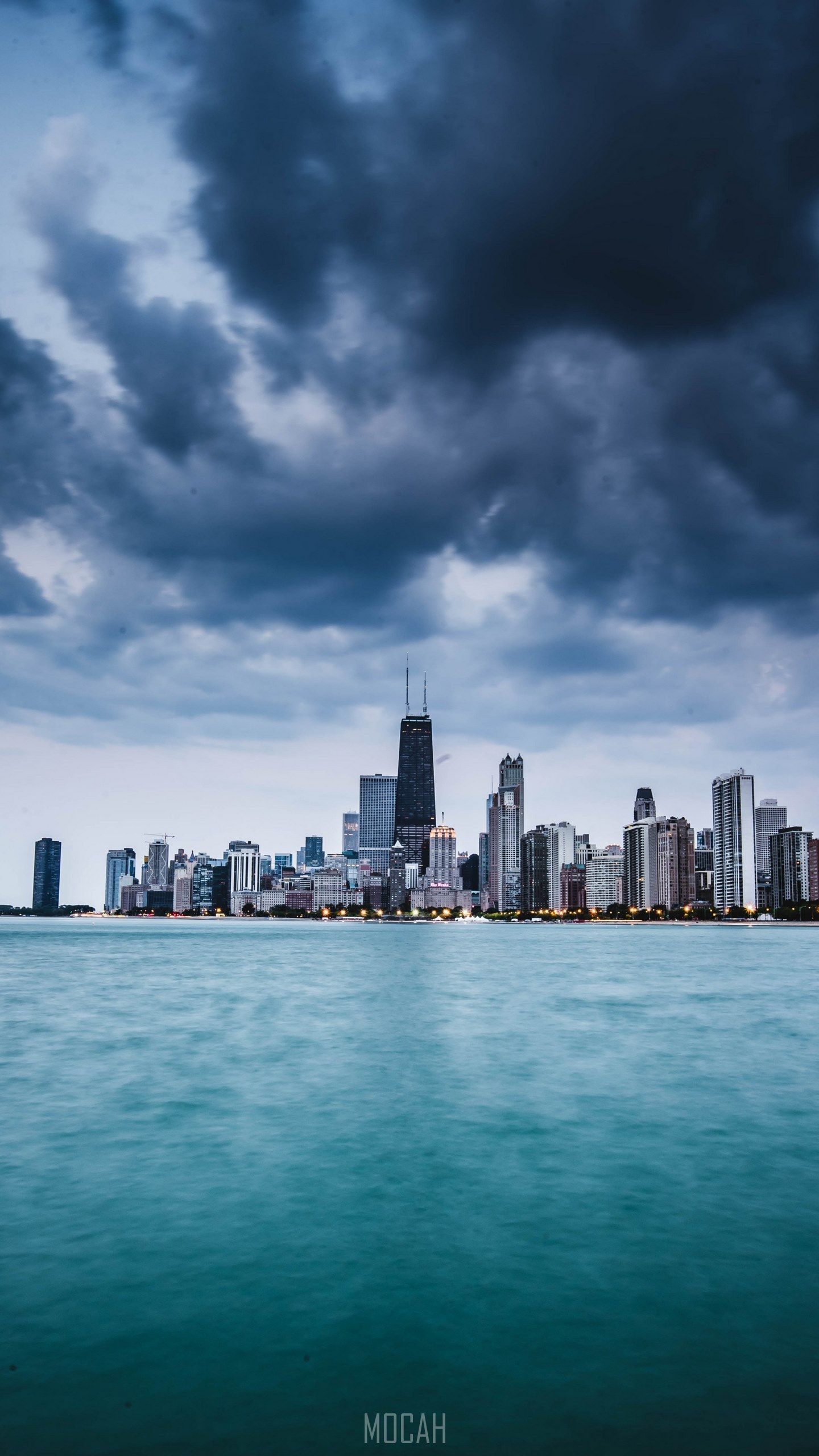 A city skyline is seen from the water - Chicago